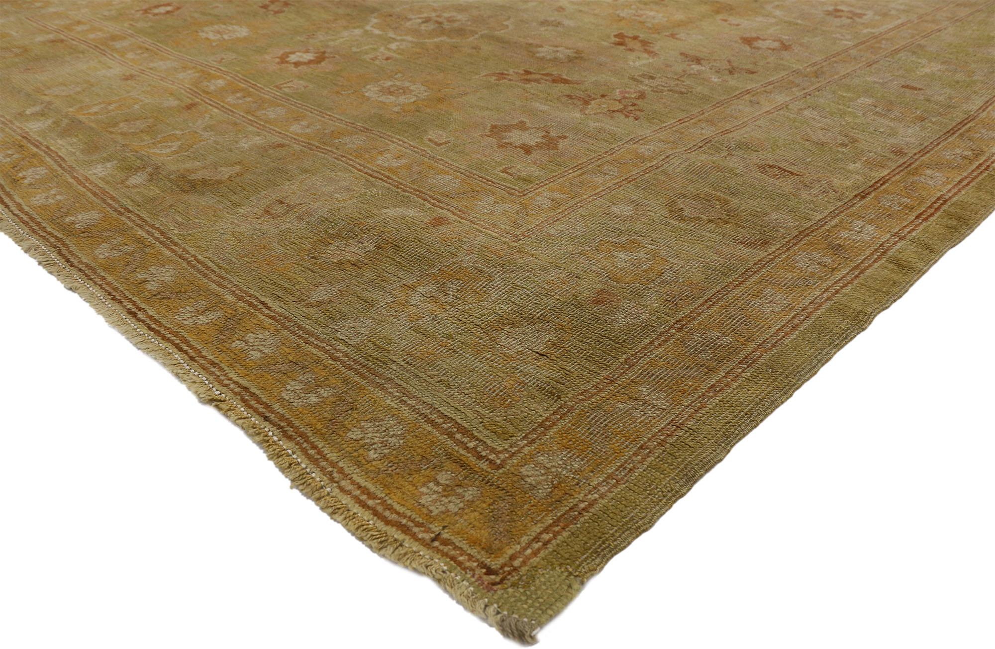 73138 late 19th-century antique Turkish oushak rug with English Cottage style. Balancing a timeless design with traditional sensibility, this hand-knotted antique Turkish Oushak rug beautifully embodies English Cottage style. The abrashed field is