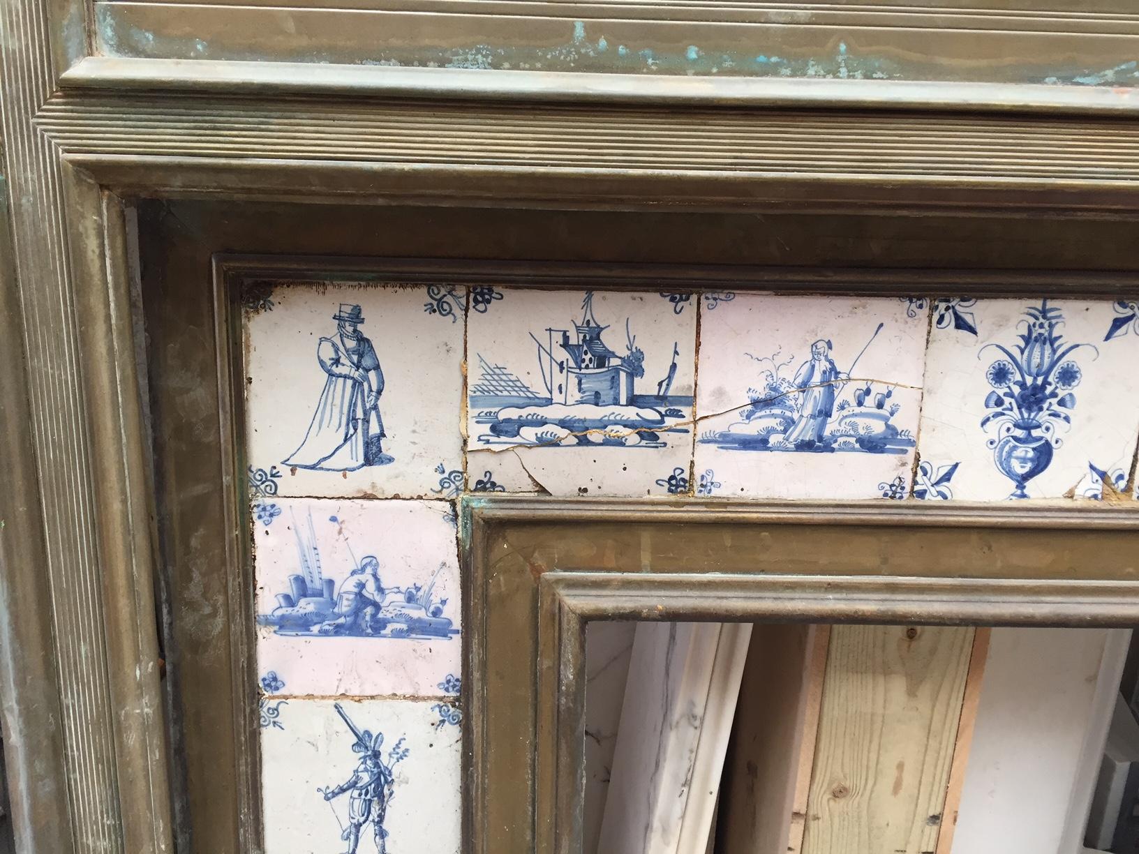 An unusual brass fire surround with delft tiles to insert, English, late 19th century. Photo prior to any restoration, grill and internal area still to be added.

Measures: 
Shelf Width:	1155 mm      	45 1/2 in
Overall Height:	1405 mm      	55 3/8