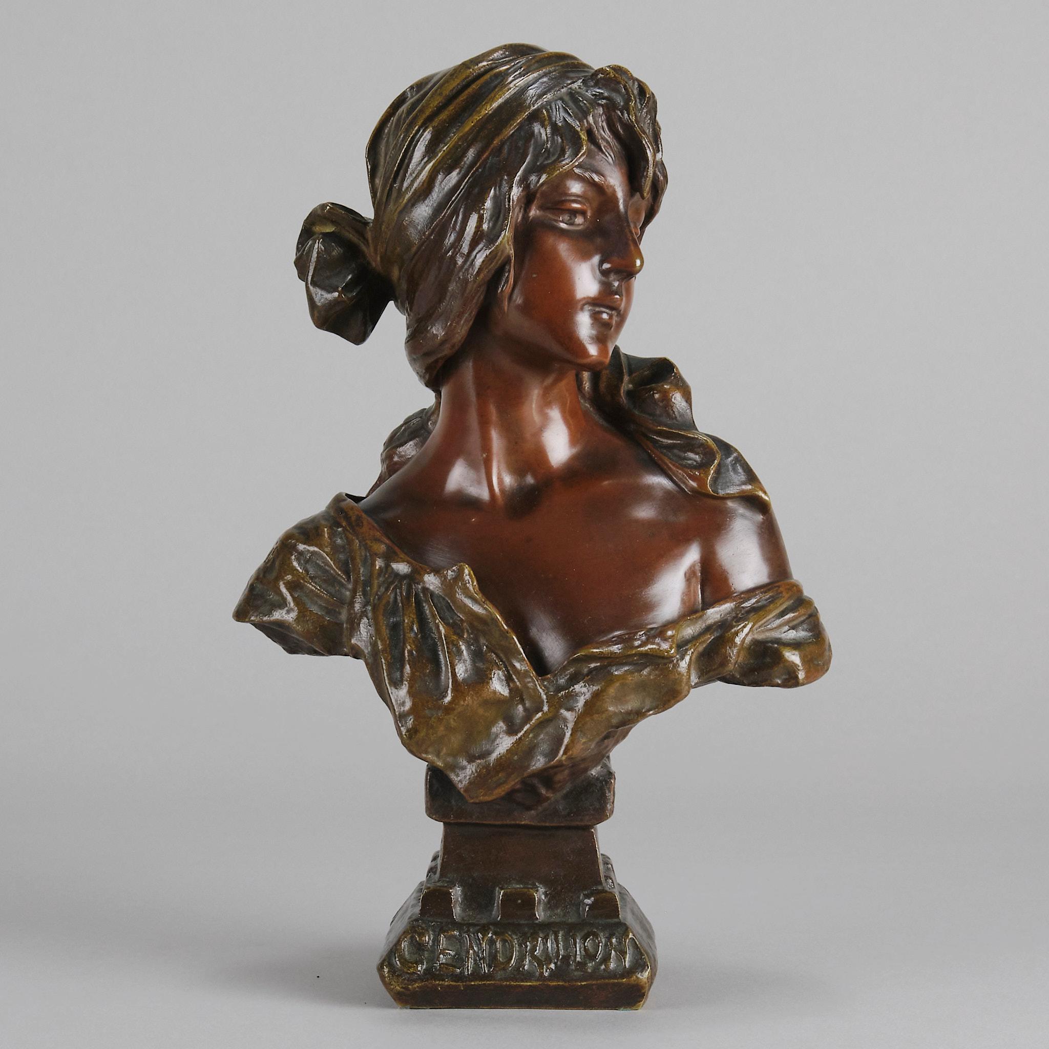 An attractive late 19th Century Art Nouveau French bronze bust exhibiting deep multi-hued patination and excellent detail. The beautiful character wearing a head dress and a loosely draped blouse representing ’Cinderella’ from the famous French