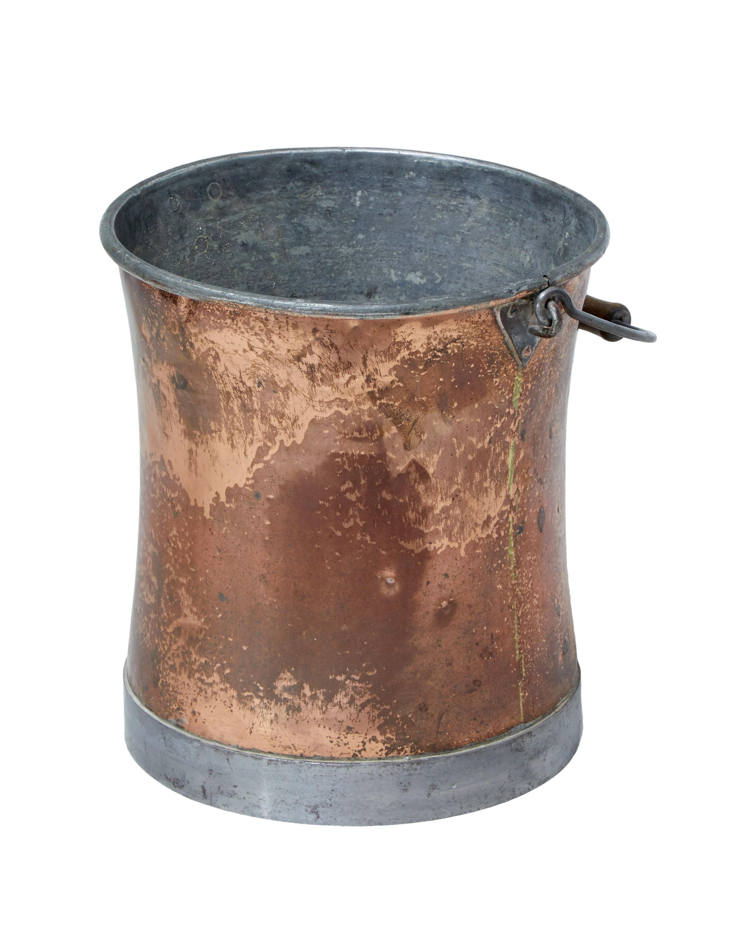 Late 19th century Arts & Crafts copper bucket, circa 1890.

Steel and copper bucket. Nicely shaped compared to the norm. Complete with handle and original wooden grip.

Ideal use for today as a waste paper basket or kindling bin.

Expected