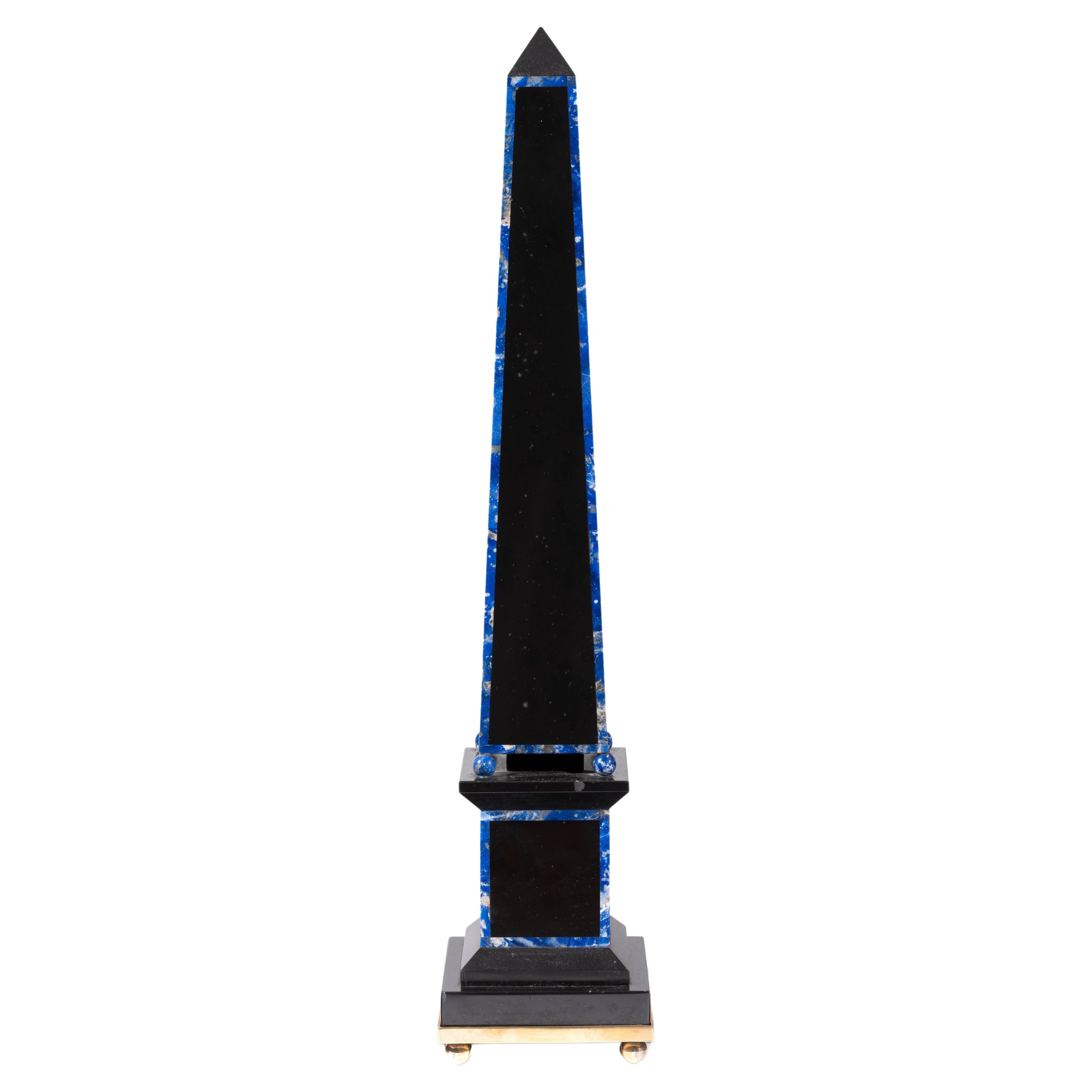 Shipping policy
No additional costs will be added to this order.
Shipping costs will be totally covered by the seller (customs duties included). 

This Louis XV style black marble and lapis lazuli.
Measures: Height 52cm
Diameter 8cm.


