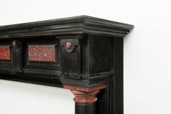 Caminetto di fine Ottocento in marmo nero con Rouge Griotte