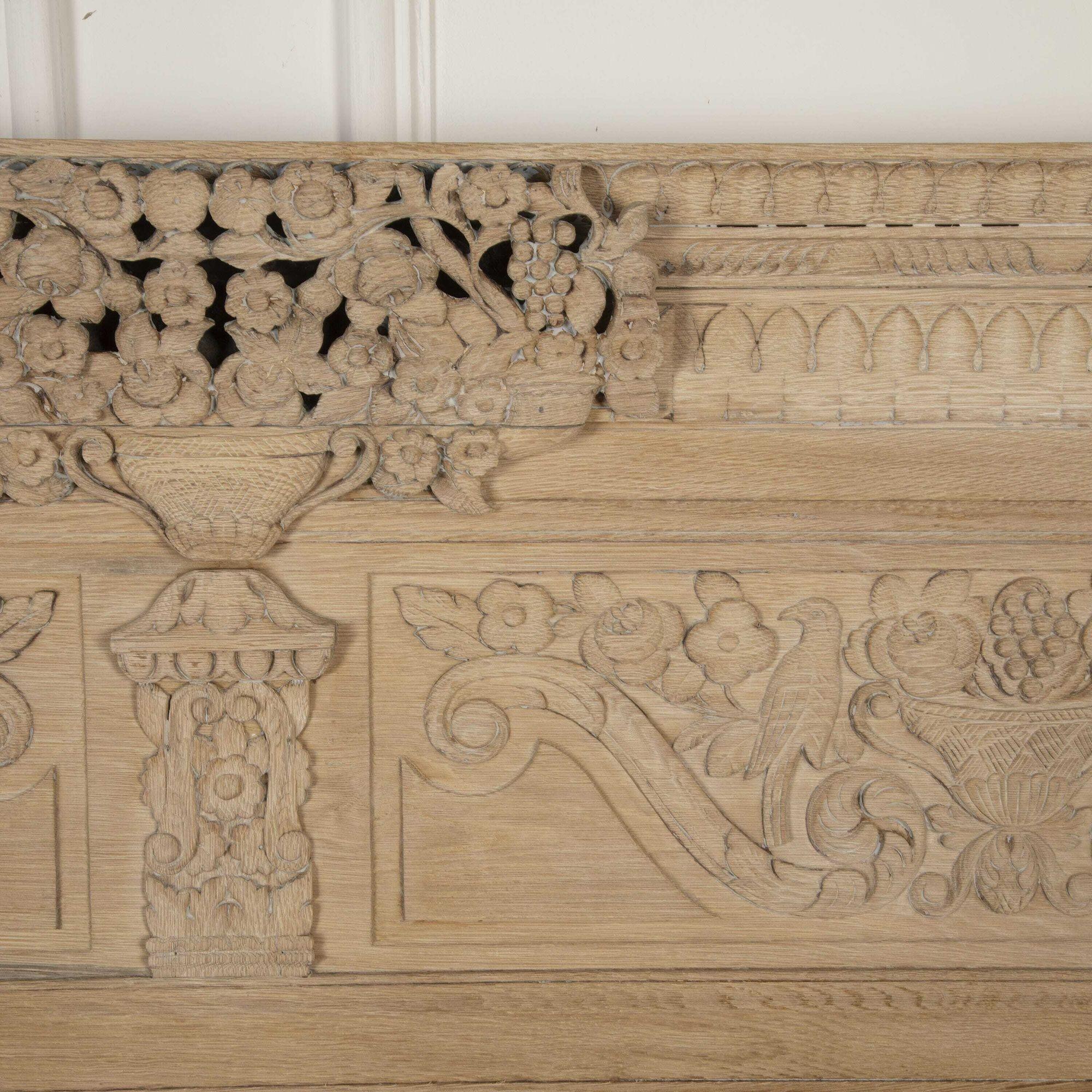 Late 19th century king-size bedstead from the Montebourg region of Normandy.
Solid hand-carved oak, now scrubbed back and bleached.
The headboard measures 139.5cm tall and the footboard measures 79cm tall.
The original side rails (extended) take