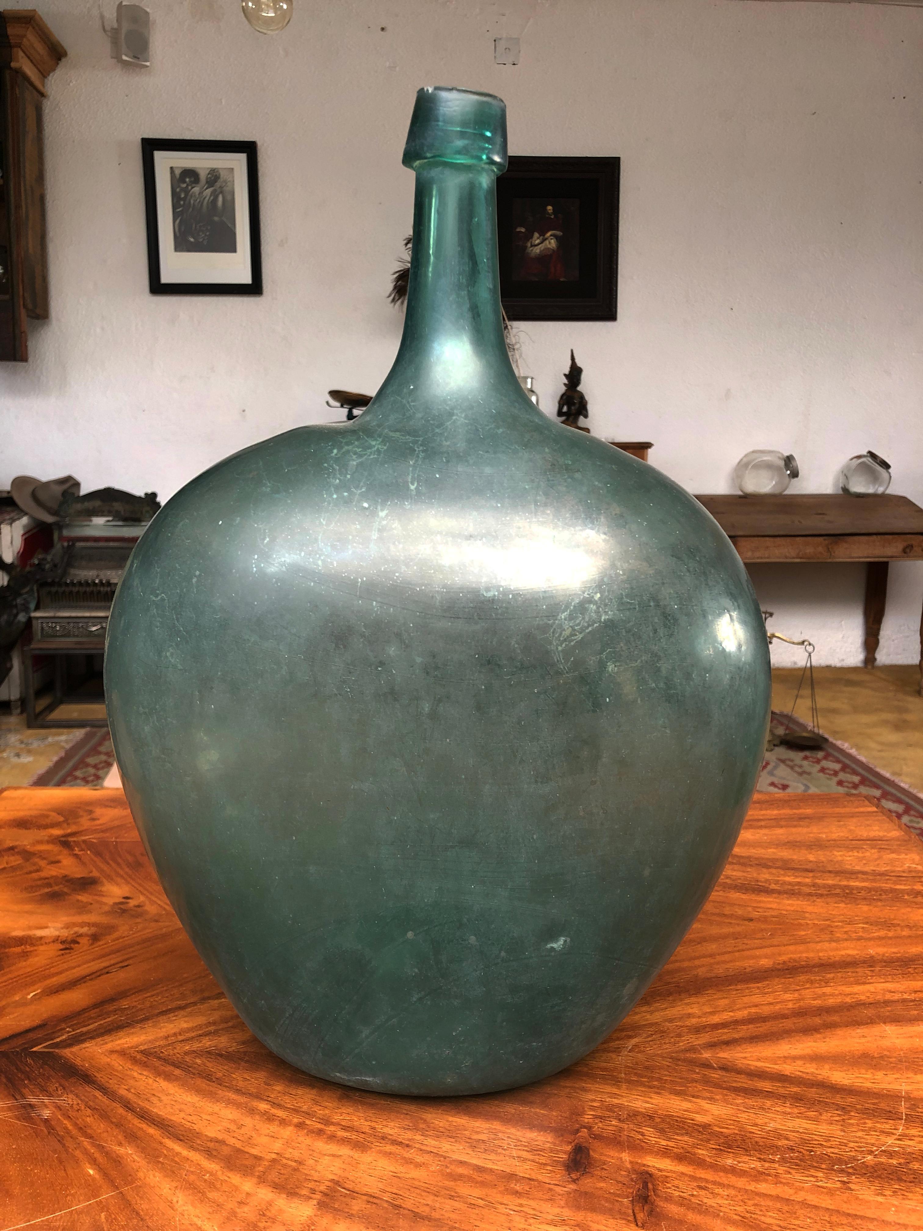 Late 19th century blown glass light blue demijohn bottle with a beautiful bold irregular sculptural form and a very deep dished pontil. Dating anywhere from the late 18th-early part of the 19th century.