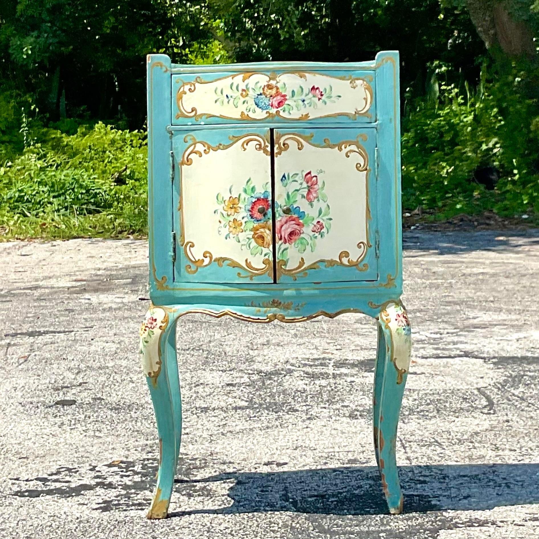 A fabulous vintage Boho nightstand. A chic hand painted cabinet with a beautiful floral motif and gilt touches. Lots of great interior storage. Coordinating pieces also available on my page. 