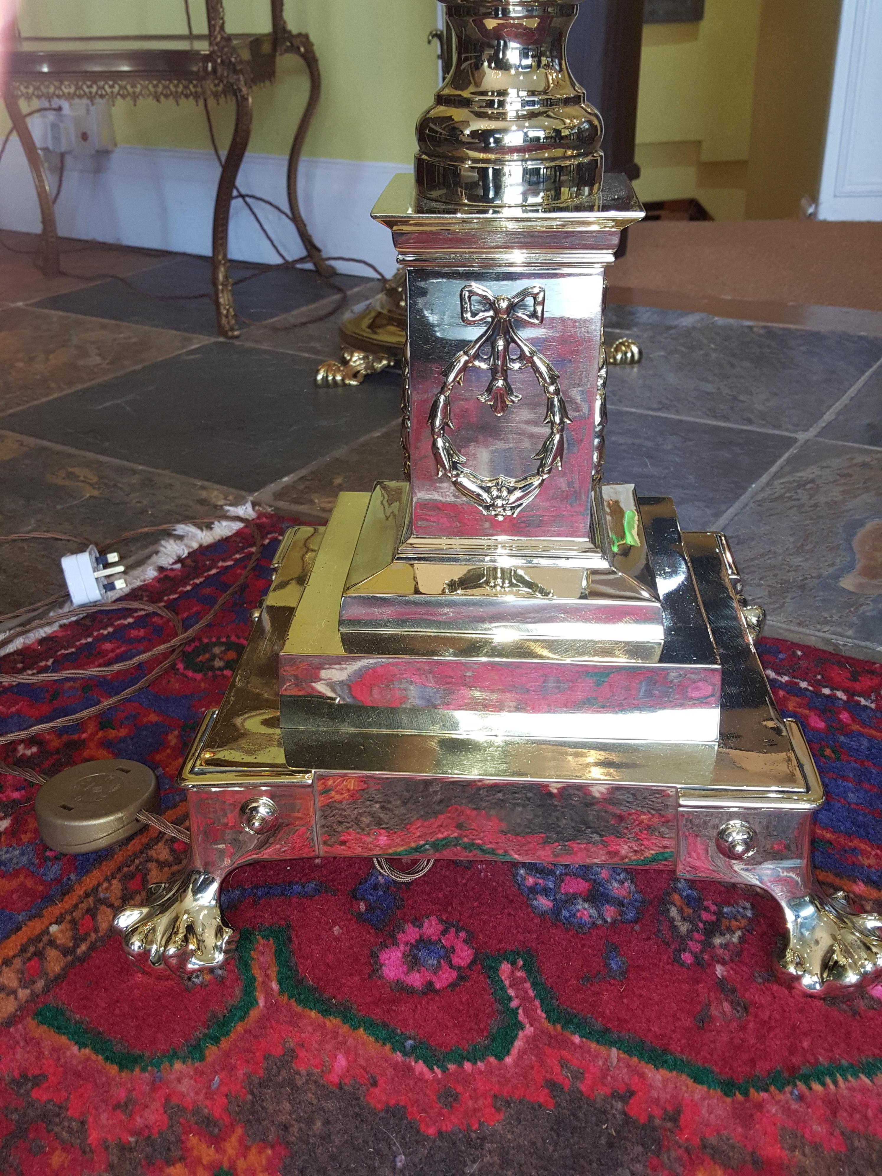 Victorian brass extending telescopic standard oil lamp with substantial Corinthian column, stepped platform base decorated with Laurel wreaths, on lion paw feet - converted to electric -The lampshade(s) are newly handmade silks by the same maker as