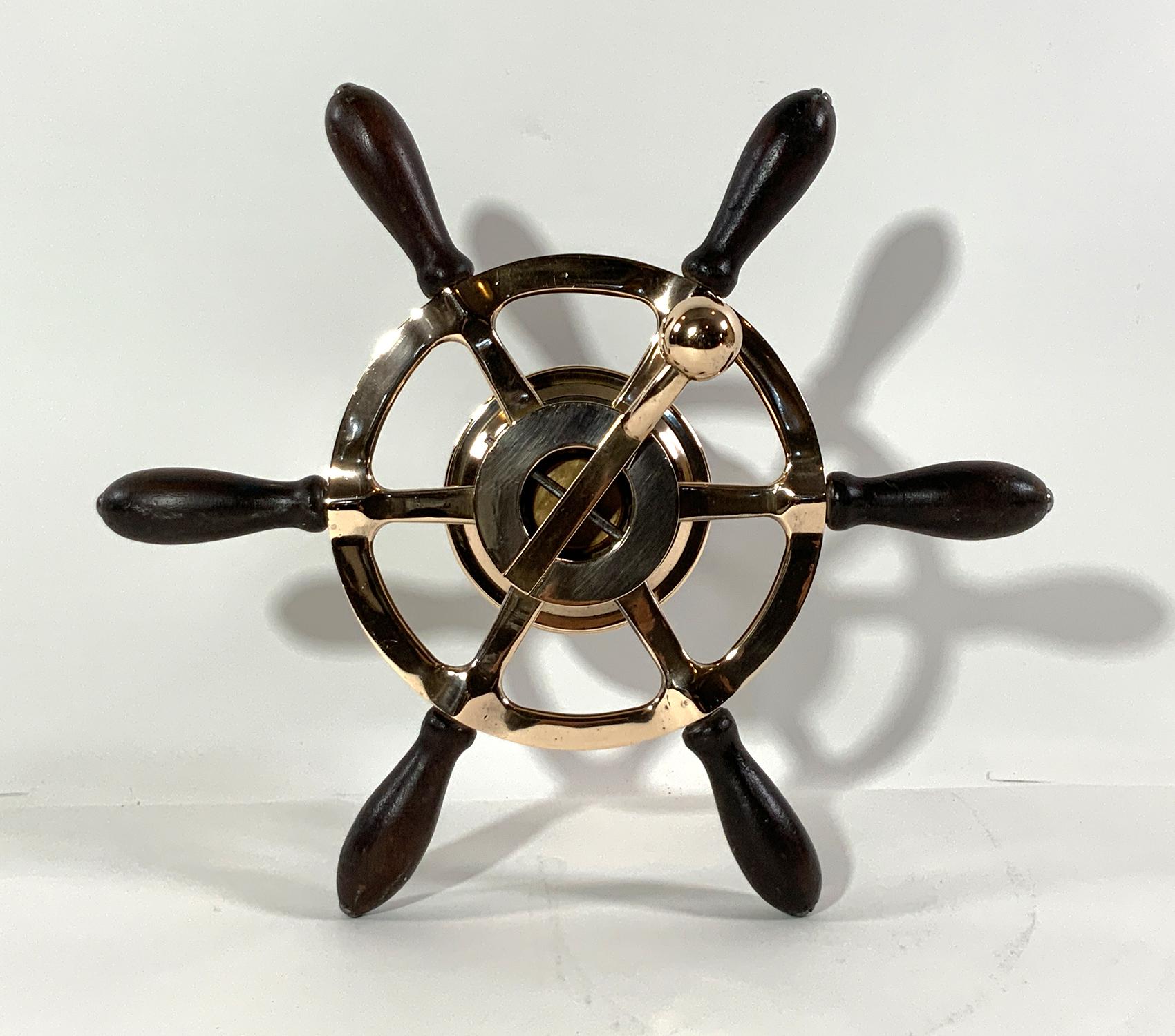 Rare late 19th century Launch steering wheel with gear lever. Six spoke with wood handles. Highly polished. Tip to tip 15.5; depth 6.75