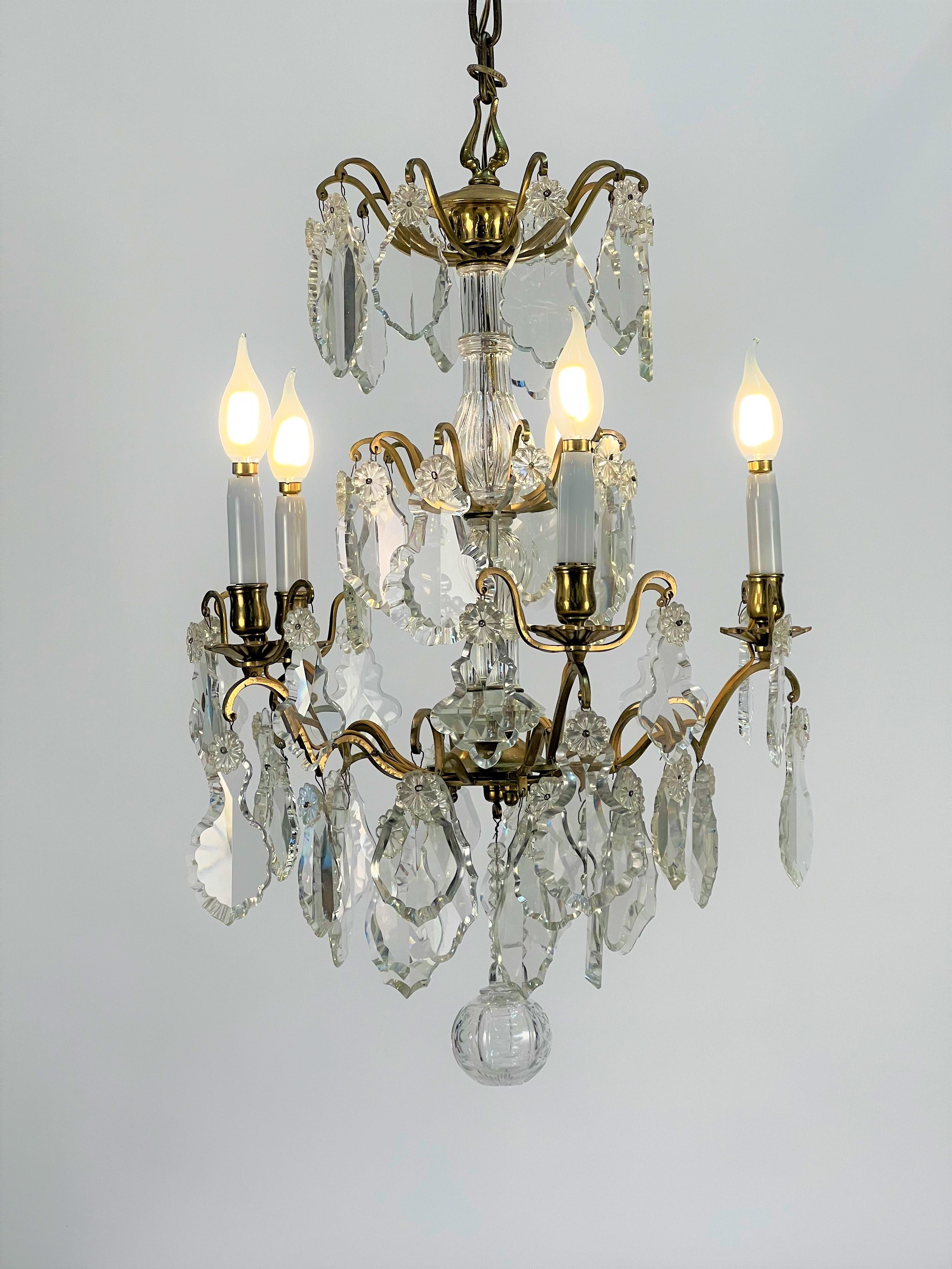 Late 19th century French bronze and crystal birdcage chandelier. Originally a candle chandelier that has been electrified by French wiring. Five US candle base sockets w/opal glass candle covers.