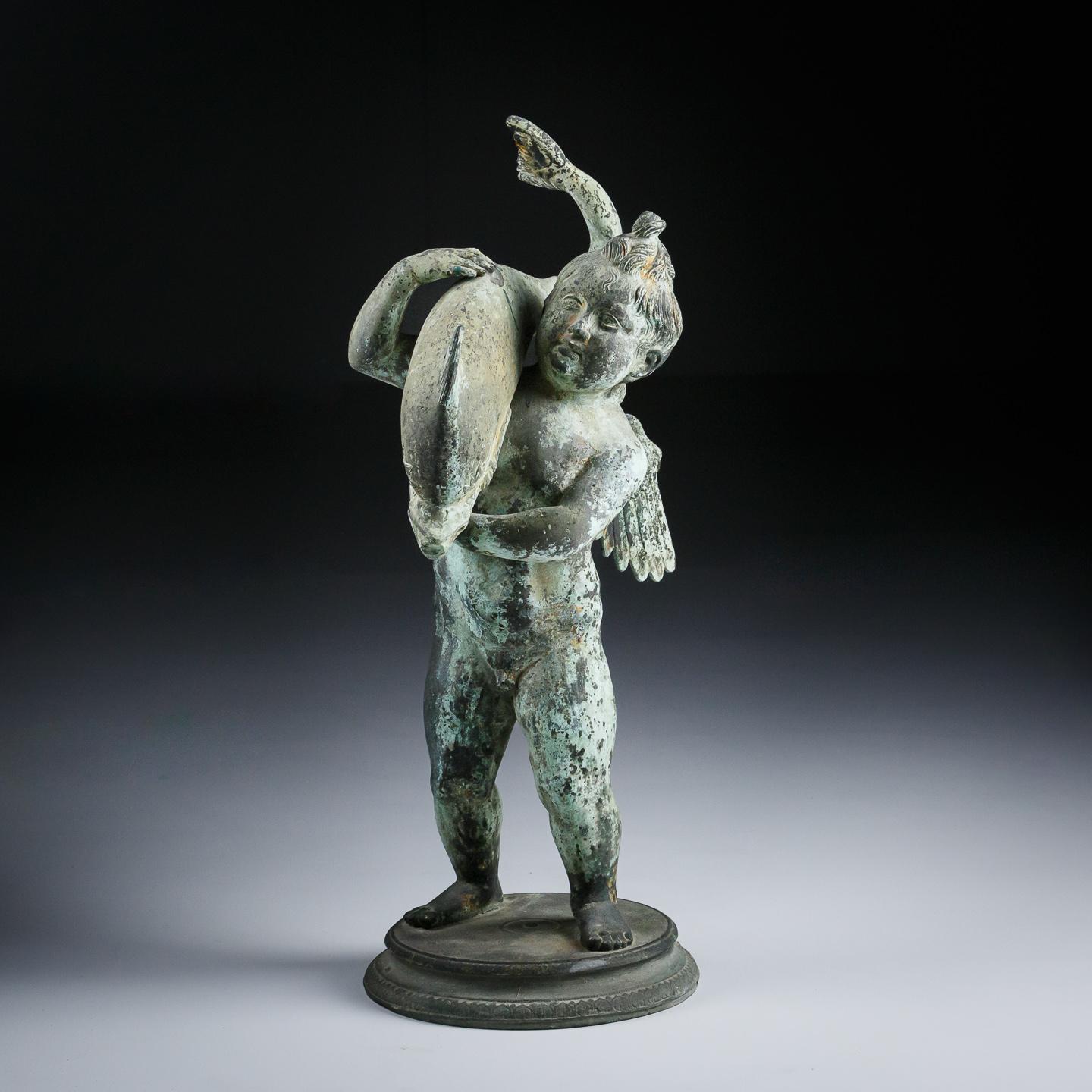 Bronze Cupid with Dolphin, cast from the original. This example by Sabatino de Angelis & Sons Naples, Circa 1880. 
The original is housed in the Museo Archeologico, Naples, a 19th Century cast such as this can be found in the original find spot in