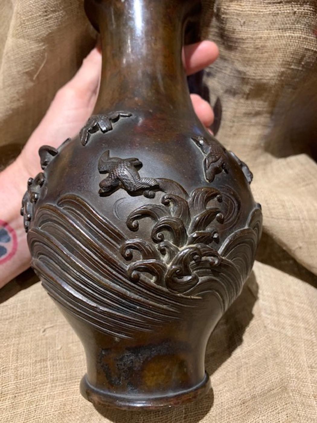 Japanese bronze hanaike, (Ikebana display vase), with Japanese sparrows flying above the crashing waves. Magnificent bronze patina.
