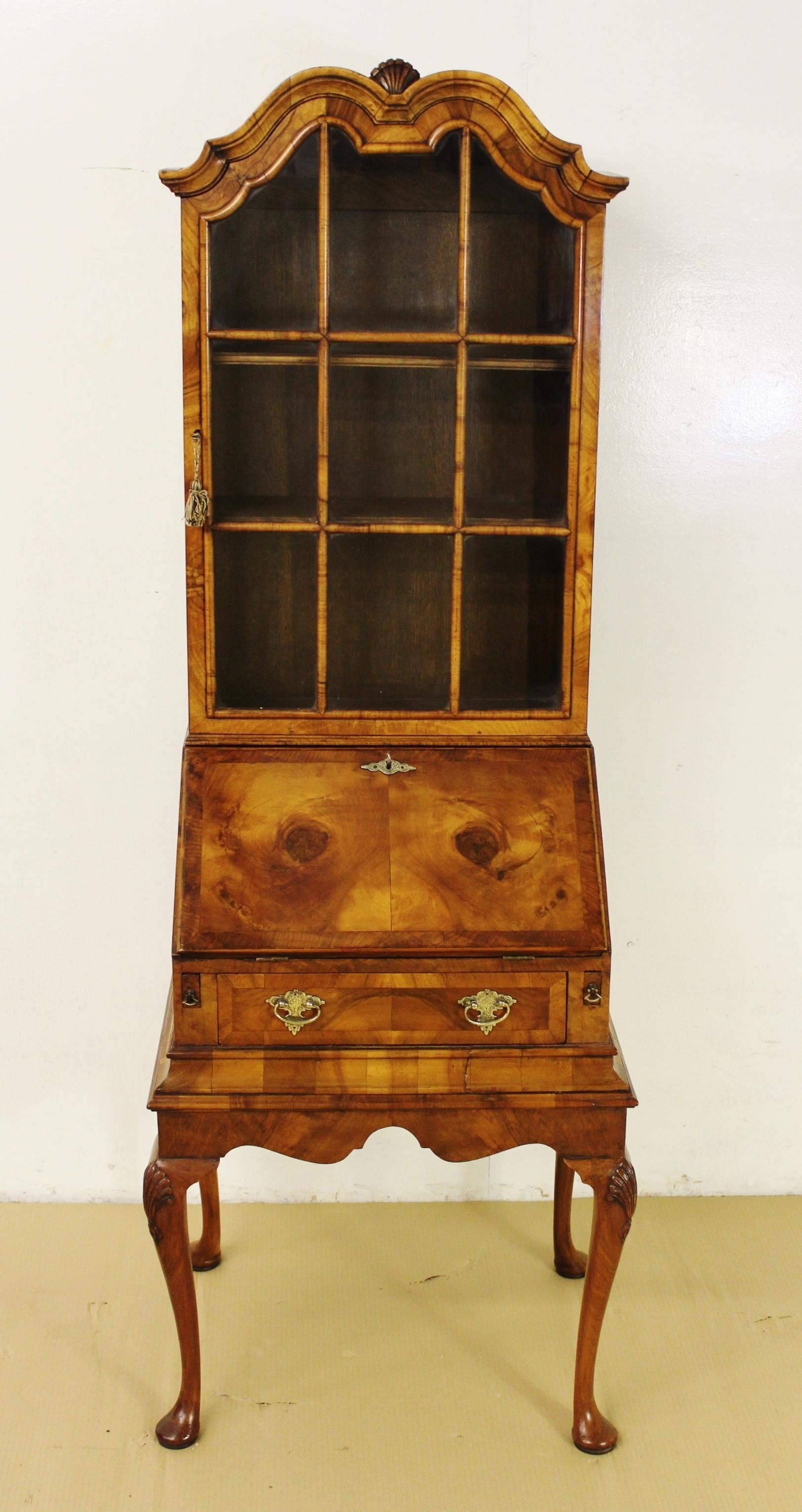 A superb Queen Anne style burr walnut bureau bookcase. Of excellent construction in solid walnut and attractive burr walnut veneers onto a solid oak carcas. This charming bookcase is of slender proportions but still affords good storage/display