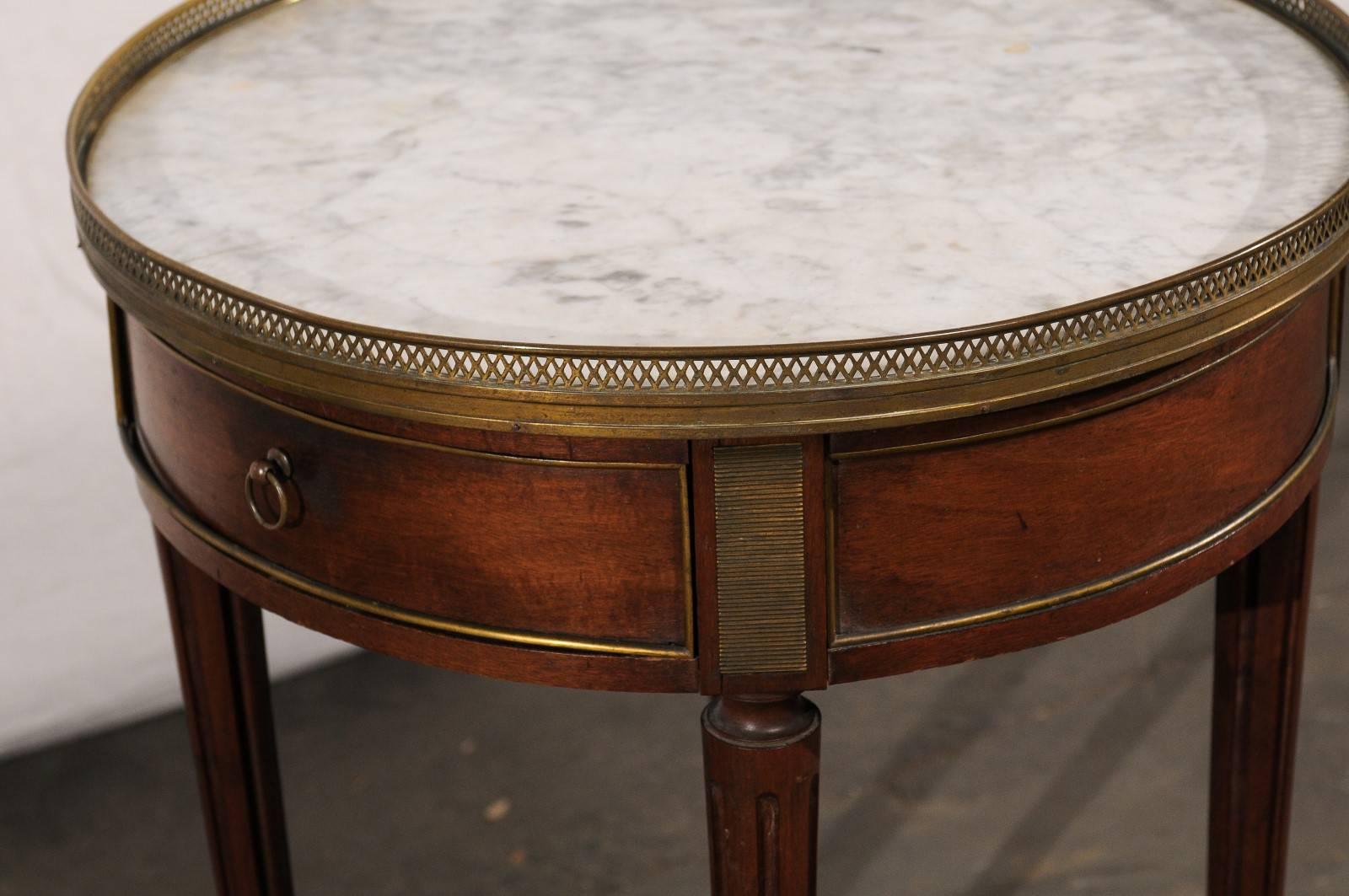 Late 19th century, circa 1890 French walnut marble-top bouillote table.