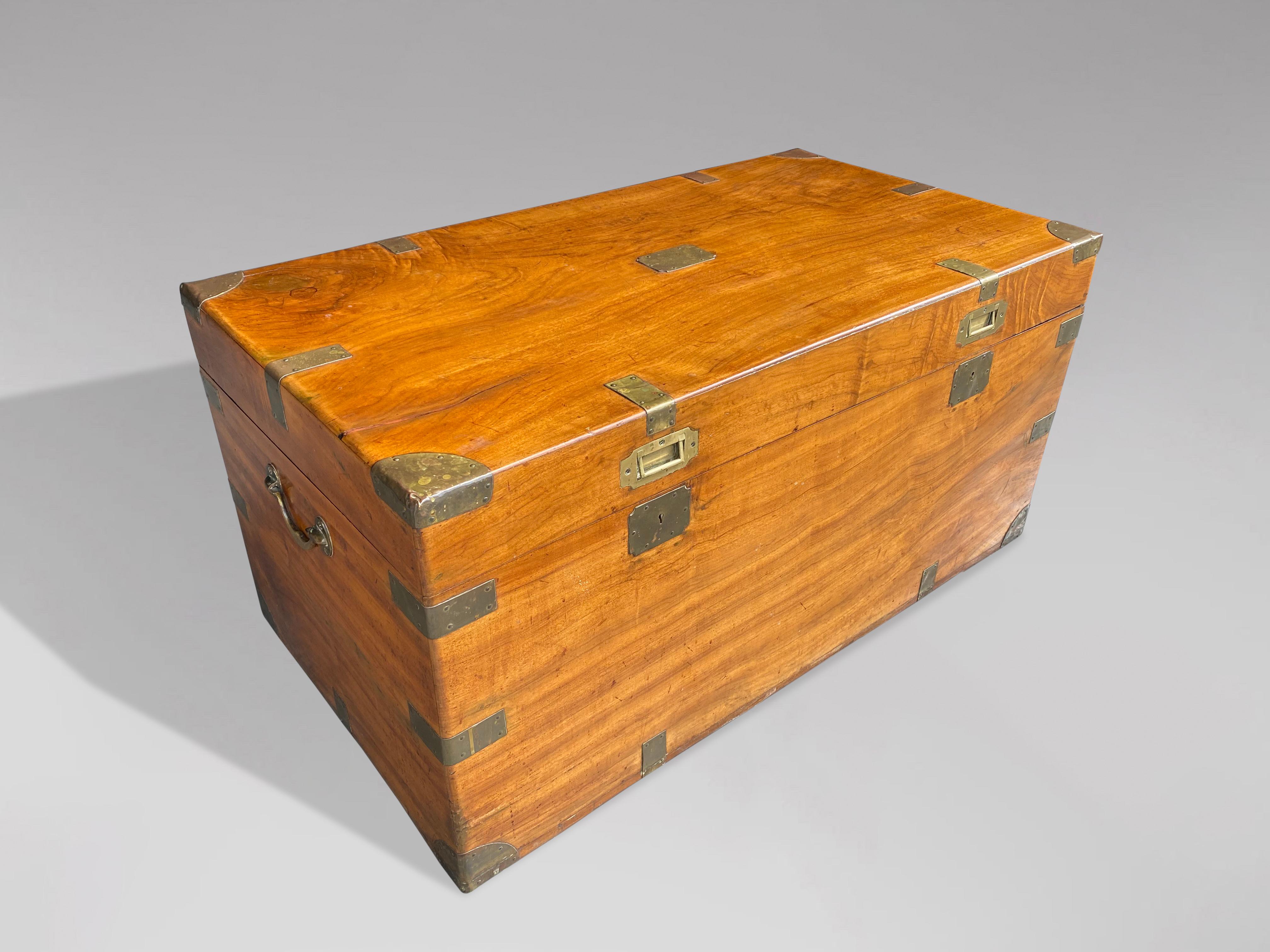 A large late 19th century camphor wood brass bound travelling chest or trunk with brass mounts and brass carrying handles. Two locks. Warm rich colour and patina. Very clean and in mint condition.

The dimensions are:
Height: 49cm