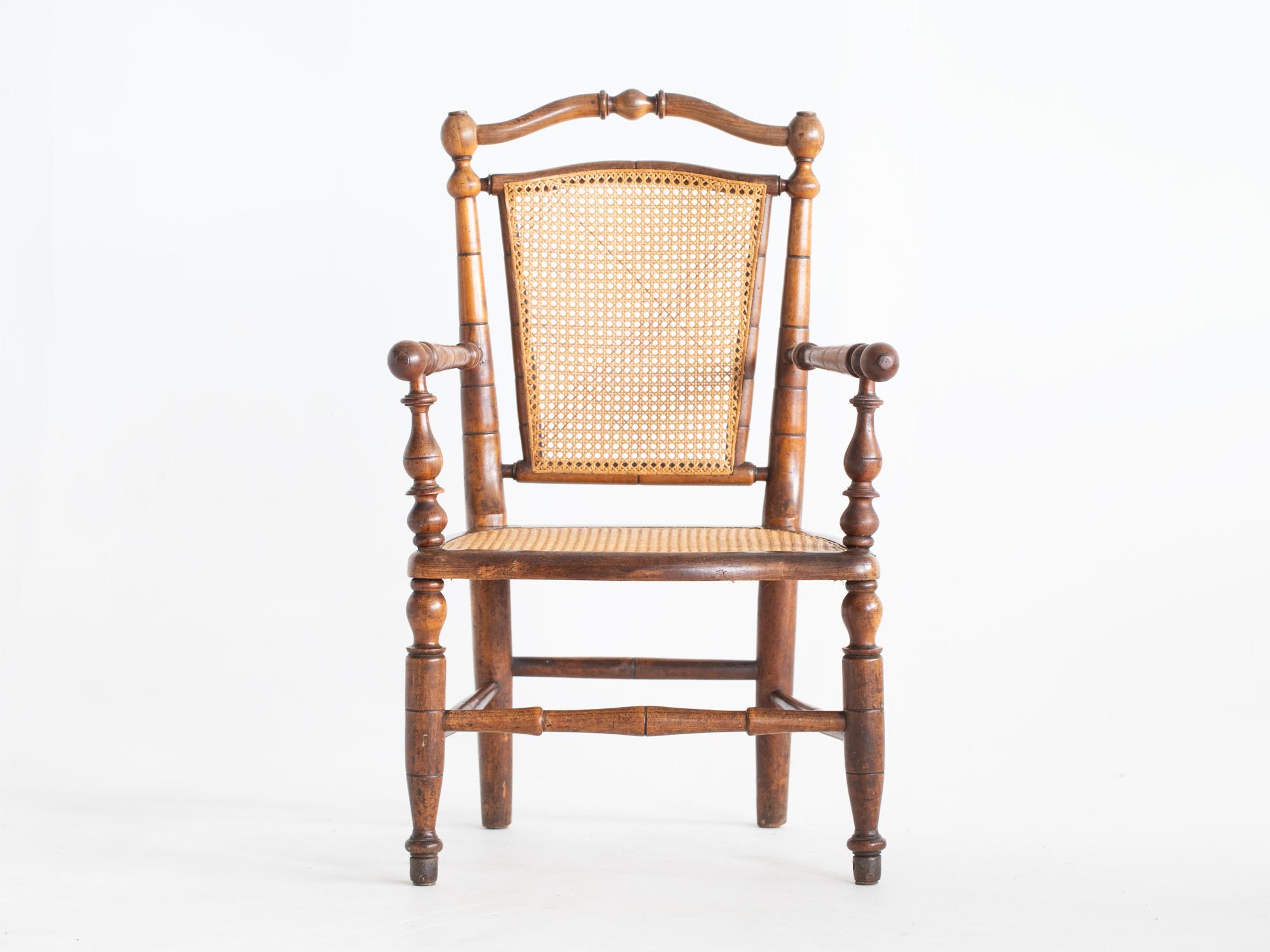 A caned faux bamboo armchair. French, late 19C.

Sturdy, patinated frame with all cane work strong and serviceable as is.

95 x 60 x 56.5 cm (37.4 x 23.6 x 22.2 
