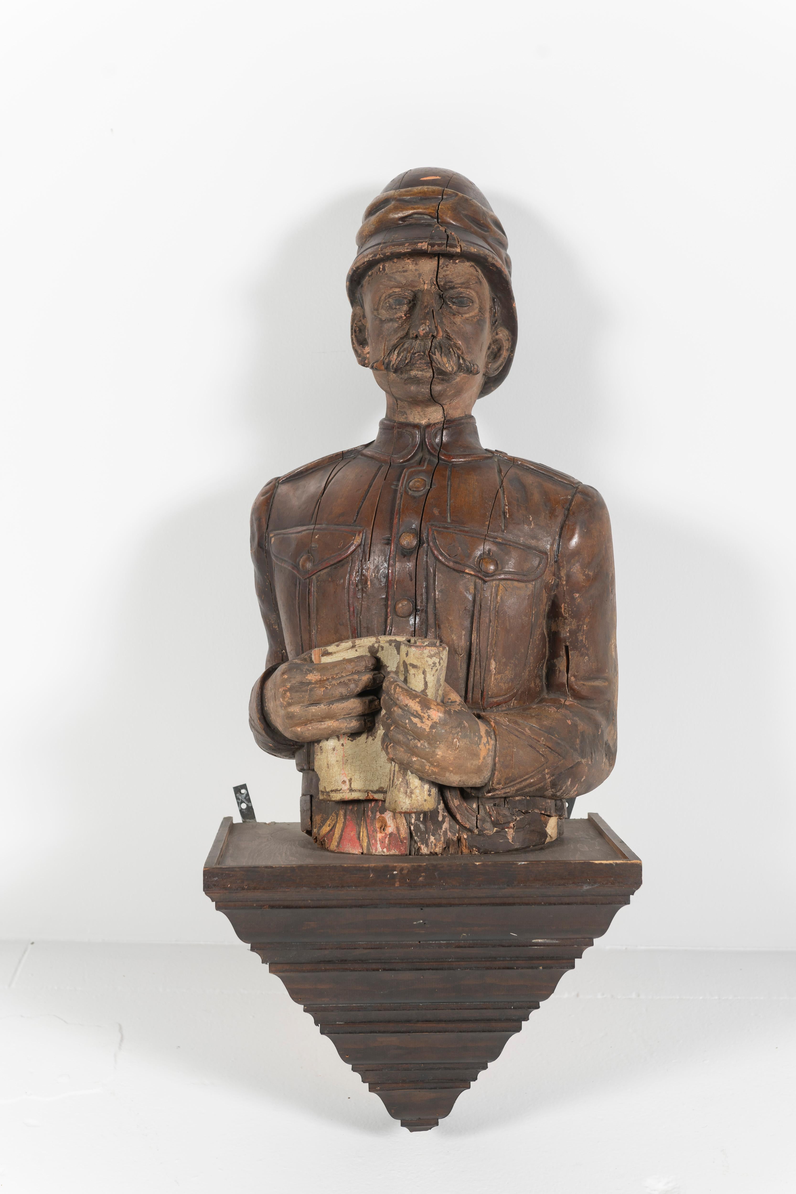 Possibly from a ship, this rare antique late 19th Century English bust is carved and painted, representing a branch of the military. Portrayed in a combat or working uniform. Interesting sculptural addition to your space. Adapted to hang on a wall.