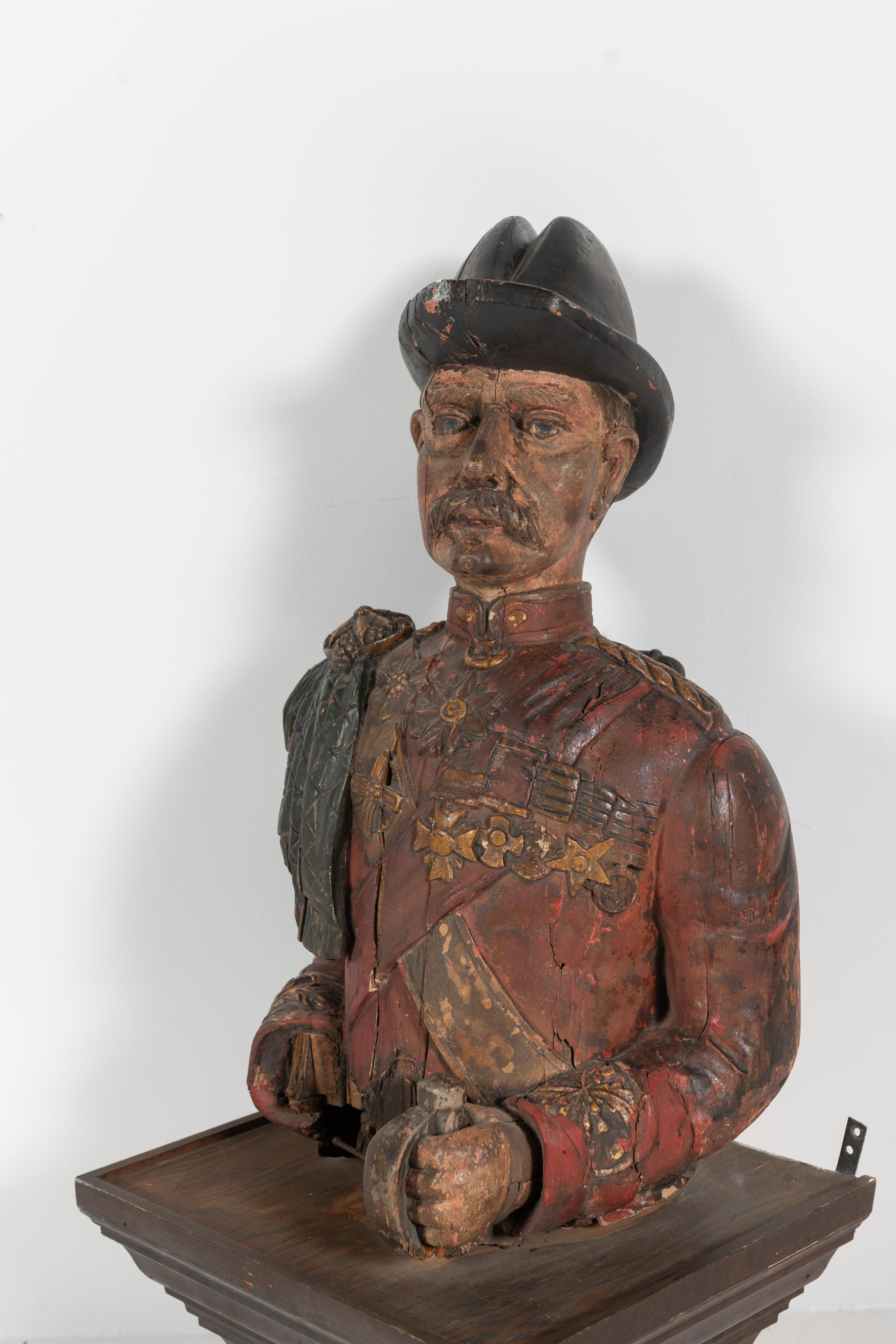 Possibly from a ship, this rare antique late 19th Century English bust is carved and painted, representing a branch of the military. Portrayed in dress or formal uniform. Interesting sculptural addition to your space. Adapted to hang on a wall.