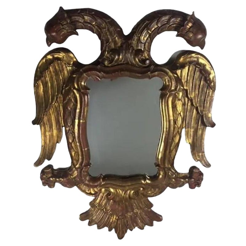 Specchio da parete con aquila a due teste in legno dorato intagliato della fine del XIX secolo