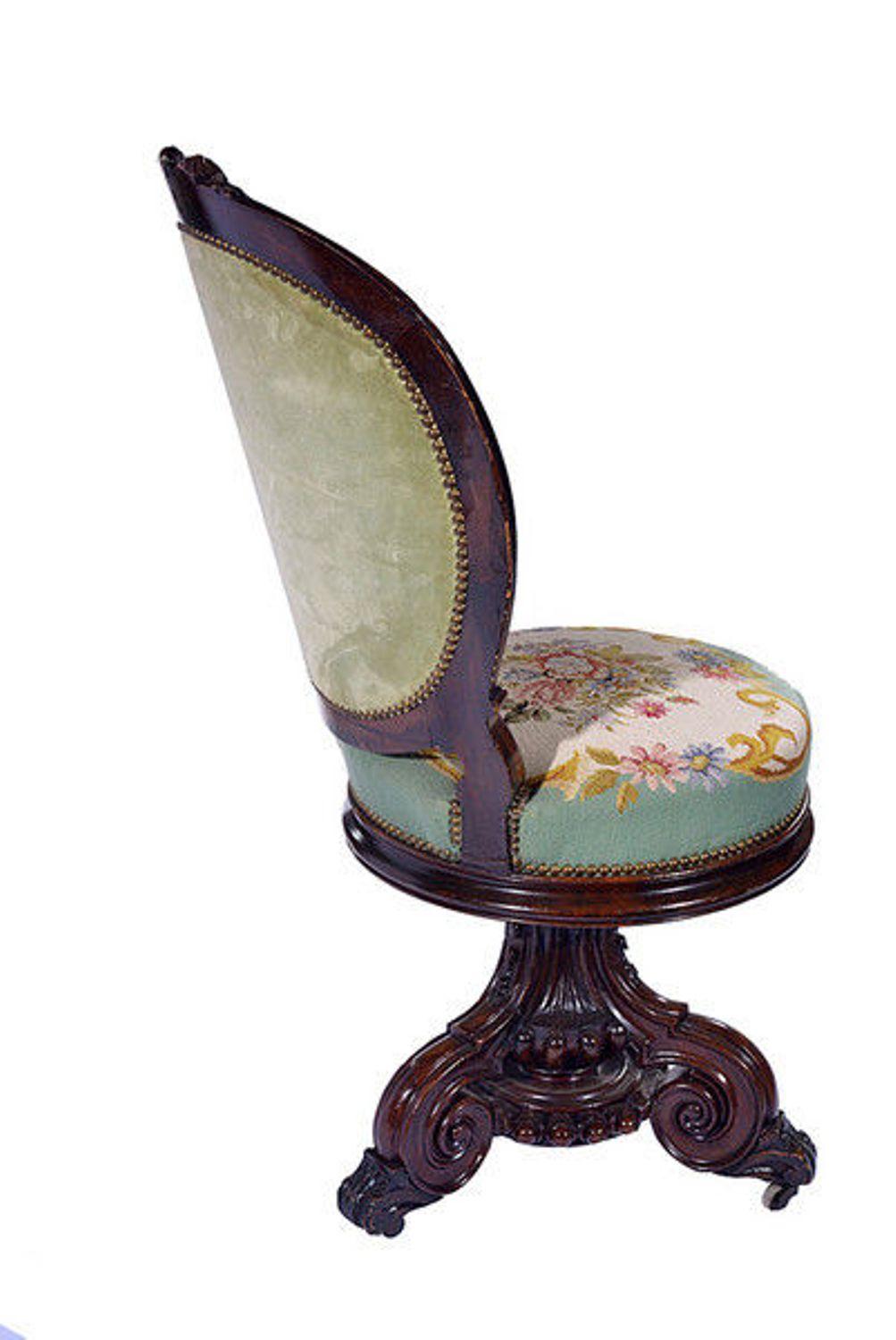 A late 19th century carved walnut revolving music chair with hand worked tapestry to the seat and cameo back.
The moulded cameo back with ribbon bow carving to the top.
Using a swivel action the height of the seat can be altered from 53.00 cm to