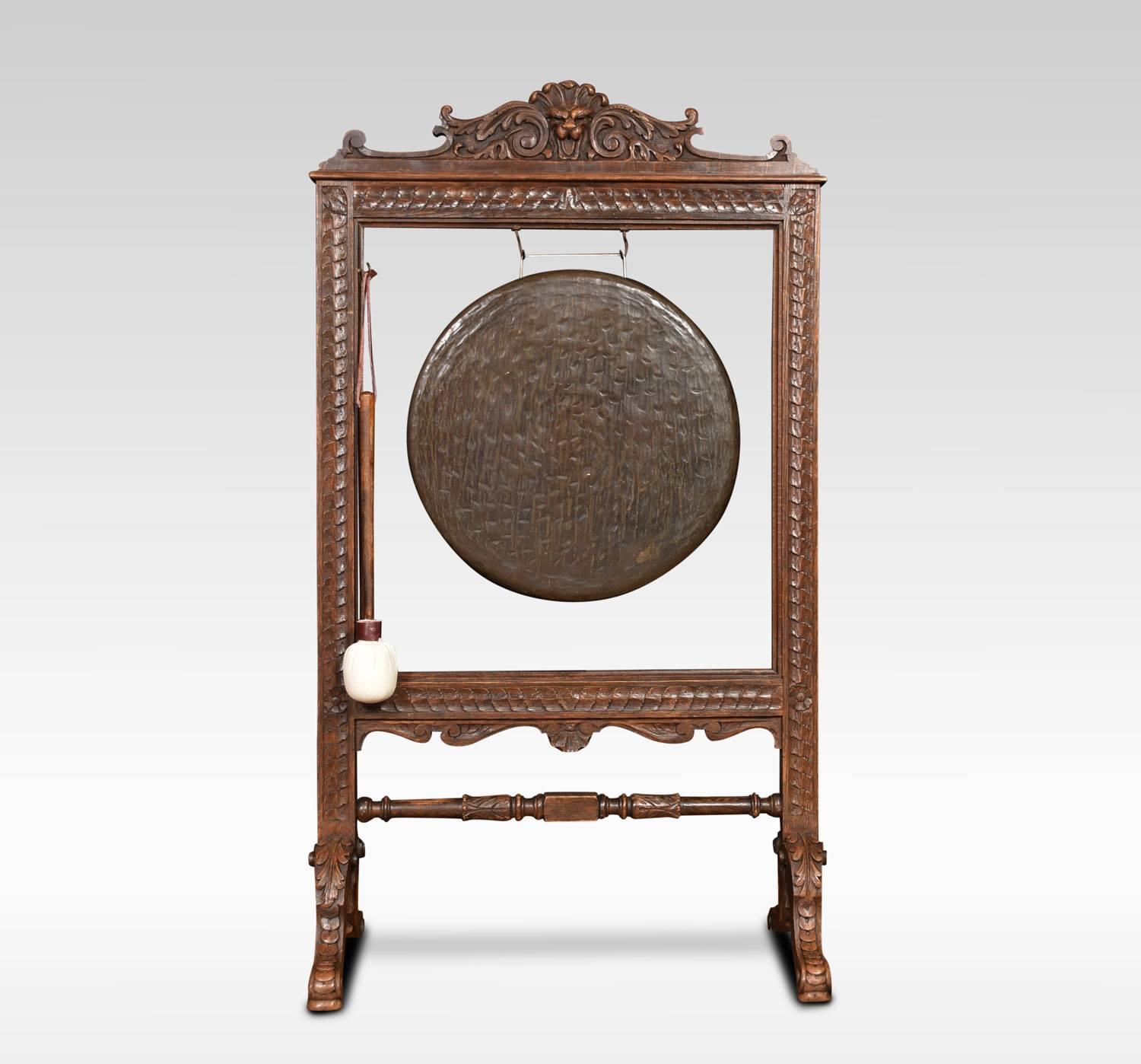 Late 19th century carved oak framed dinner gong, the circular gong within carved square frame having foliate scrolling crest and turned stretcher . All raised up on four splayed supports.
Dimensions
Height 48.5 Inches
Width 27.5 Inches
Depth