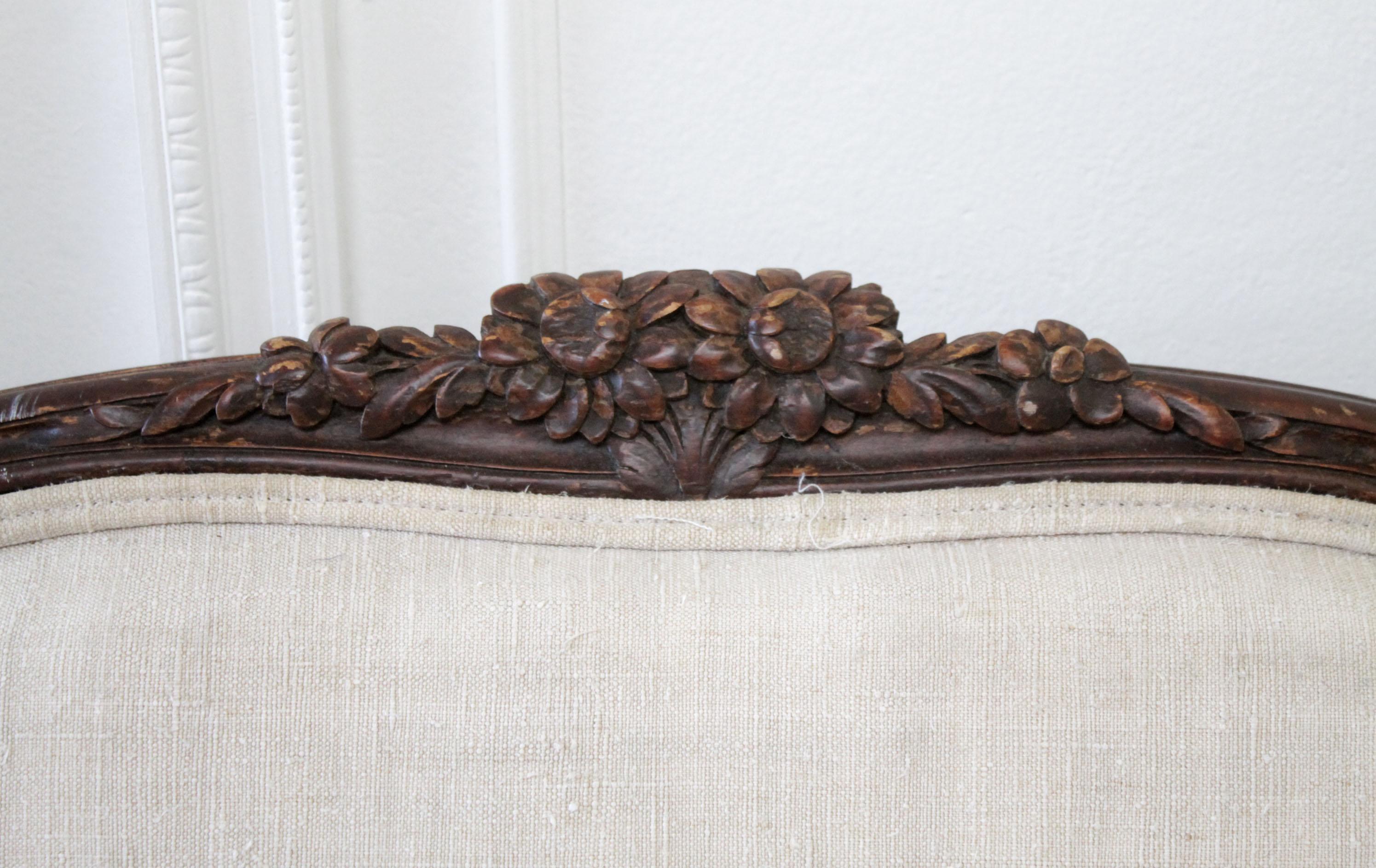 Late 19th century carved walnut sofa with antique French Grainsack upholstery
Measures: 81