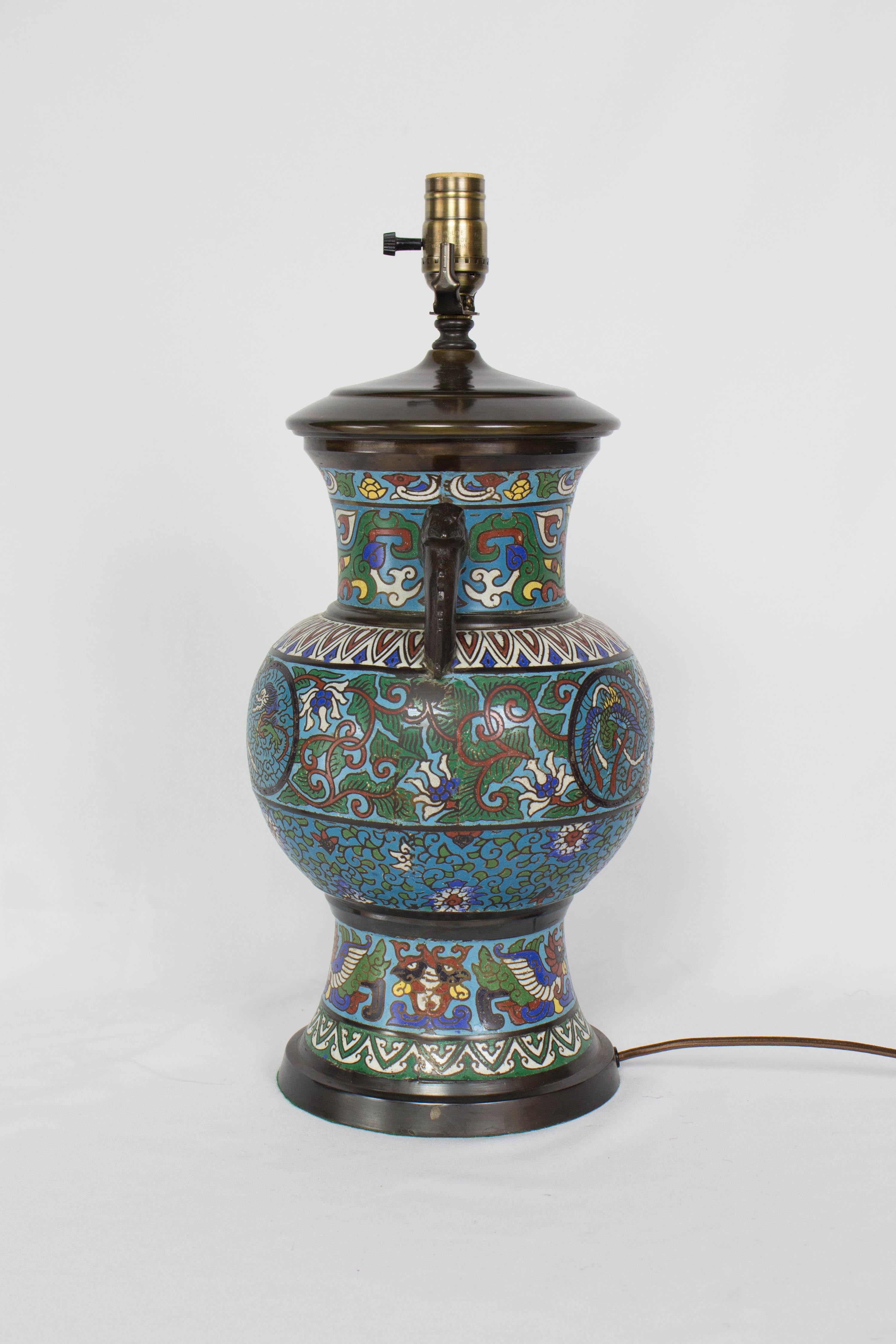 Champleve table lamp with Dragon Design, Two Handles. brightly saturated blues and reds.