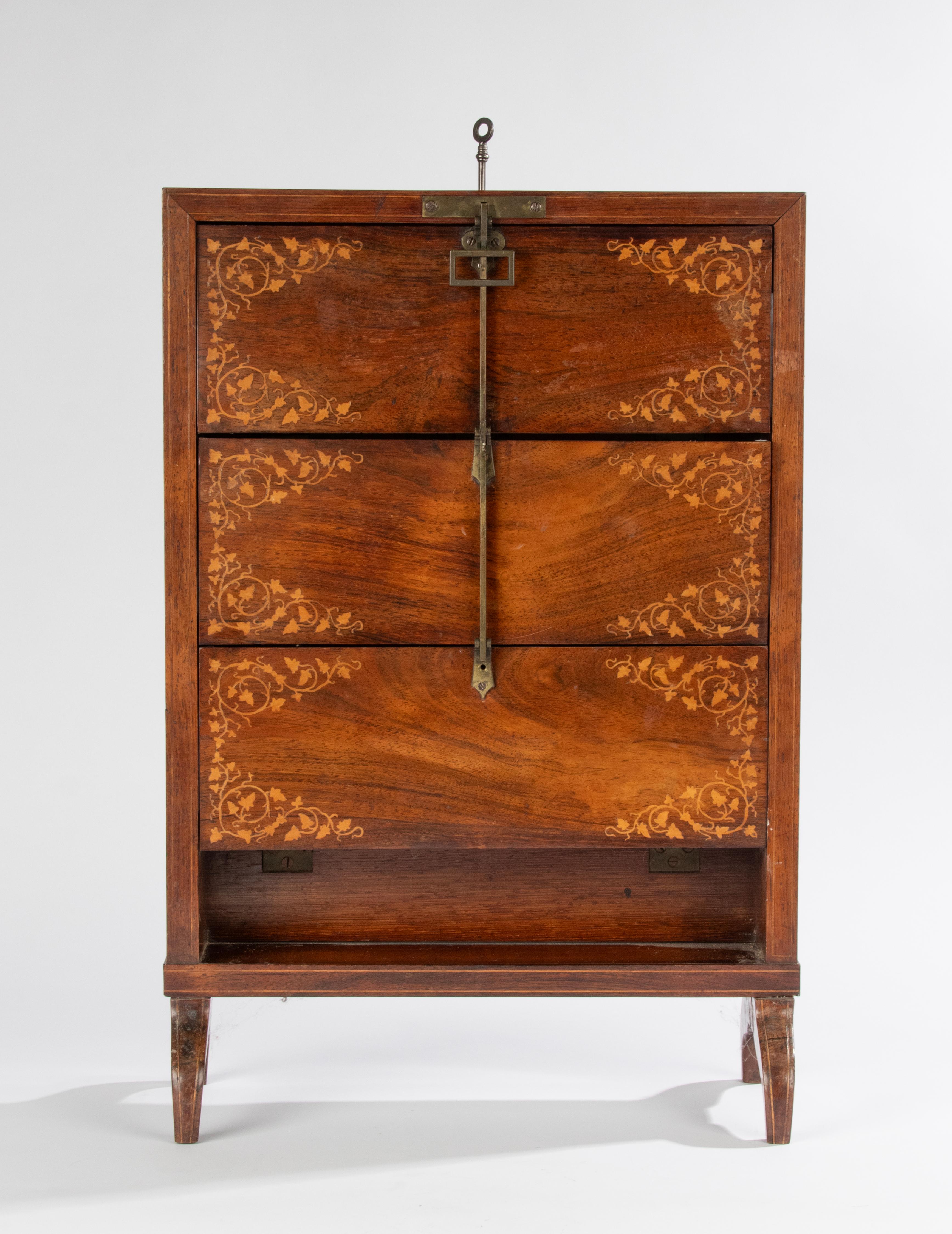 A antique desk cabinet for storing letters and cards. Made of wood veneer with foliage wood inlay. Made in France, circa 1870-1880
Note: one of the doors is slightly bent, see last picture
850
Dimensions: 60(h) x 41 x 18
Depth: storage compartment: