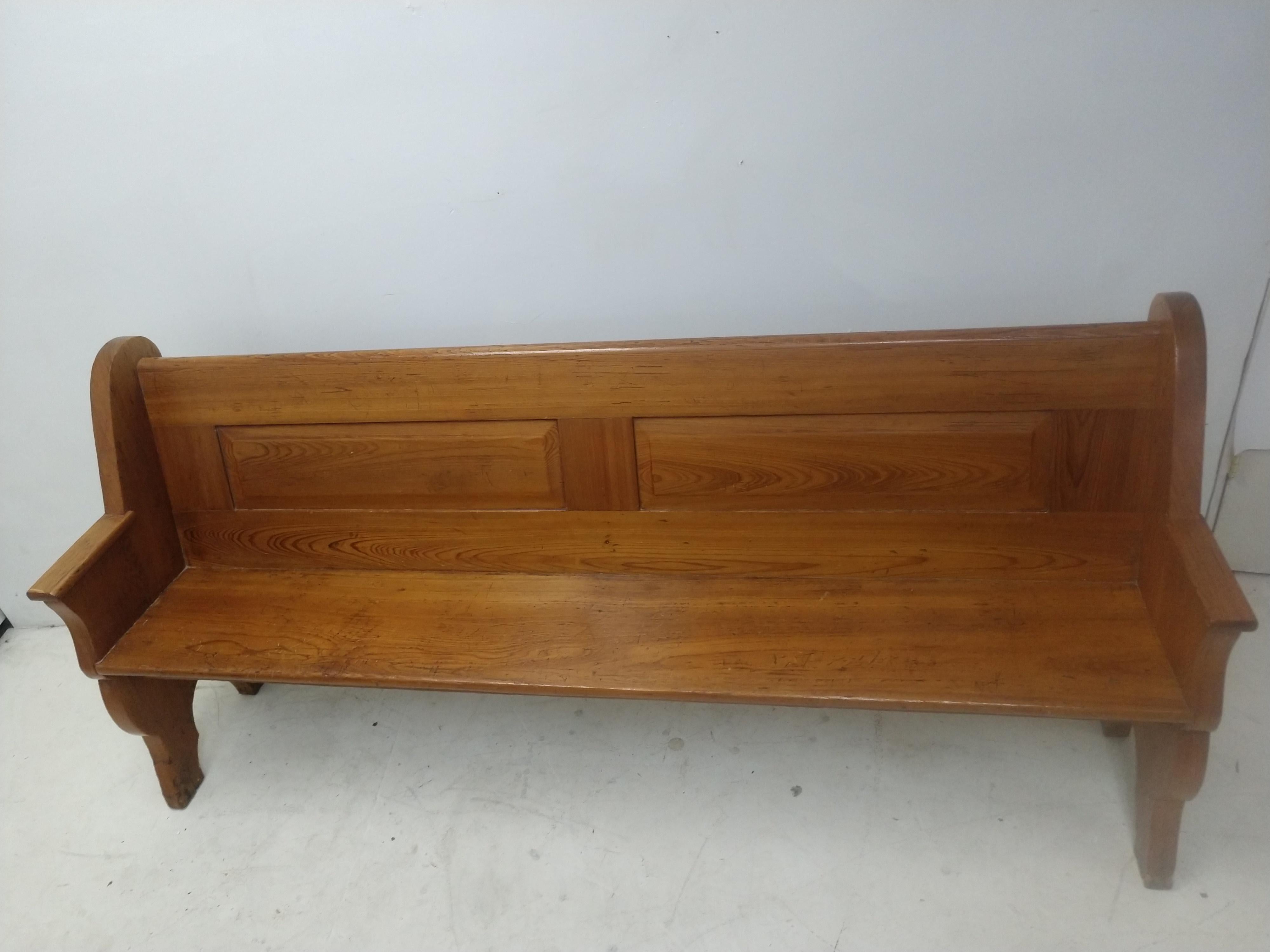Fabulous chestnut pew with fully paneled back on both sides. Simple and elegant as the chestnut has mellowed and aged. A little under six and a half feet makes it very useful in everyday situations. Dining, study, or on a porch. Seat height is