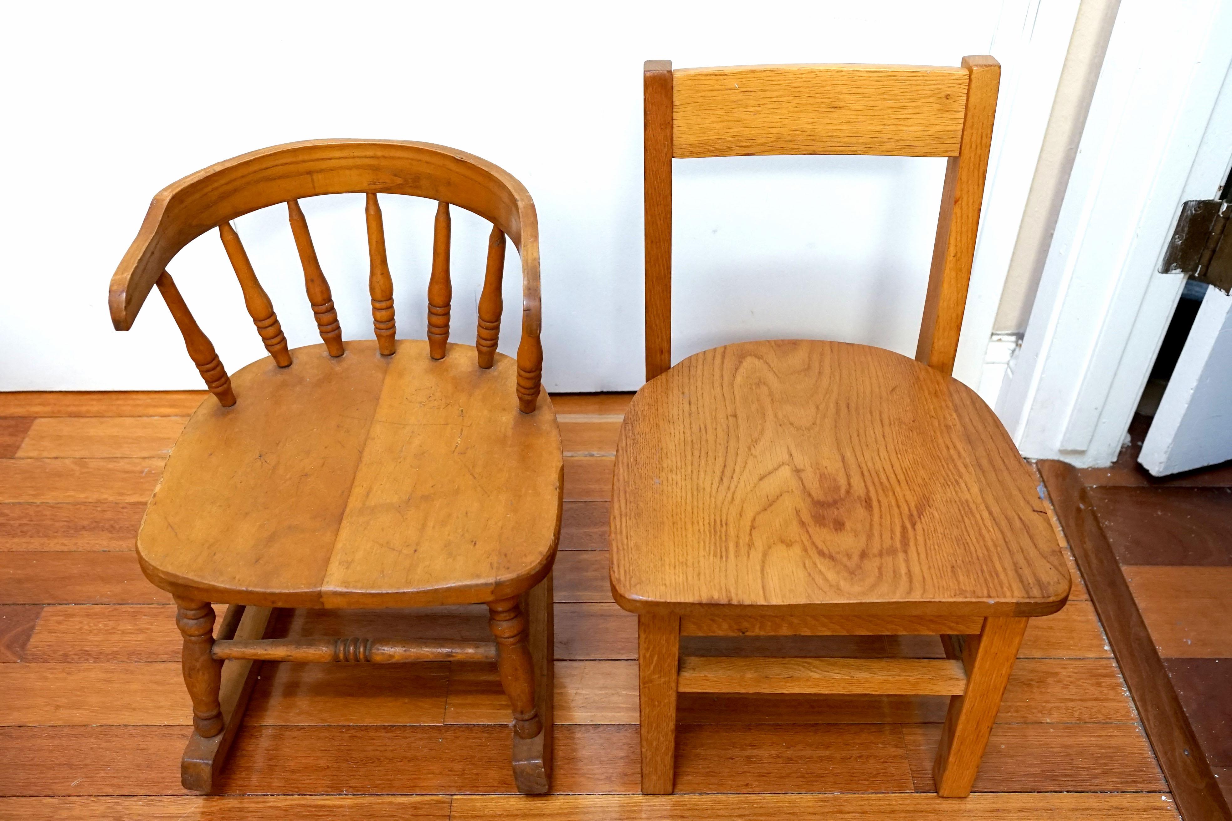 This set of children's size chairs is unique in design and scale. One is a wonderful captain's rocking chair in Windsor form. It is made of maple and ash. It has a rounded and shaped crest raised on turned spindles, turned legs and box stretchers,