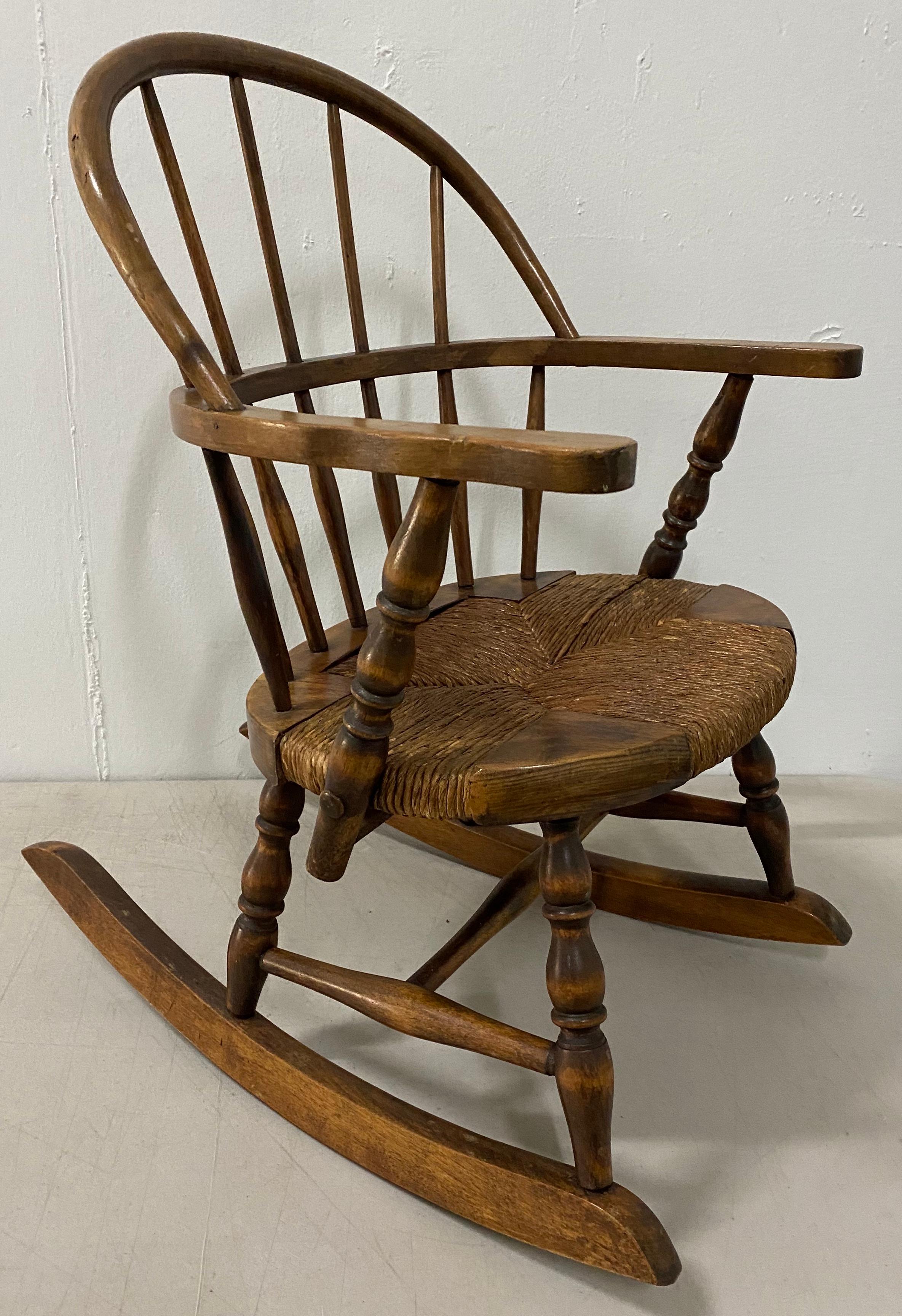 Late 19th century child's Windsor rocking chair

Custom made rocking chair with reed woven seat

Measures: 16 wide at the arms x 14