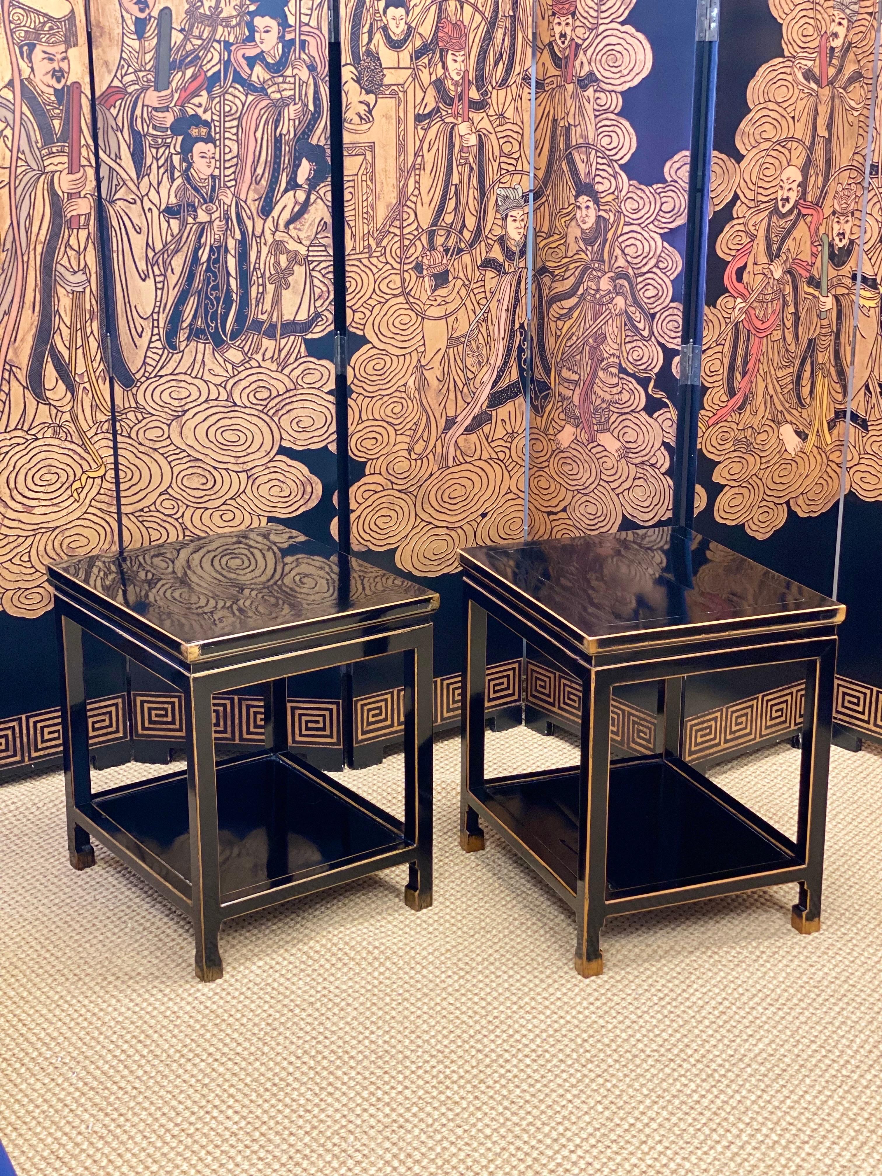 We are very pleased to offer a Chinese Qing Dynasty period side table circa the late 19th century. This solidly crafted pair features a rectangular top embellished with a waisted apron and a lower shelf. Boasting gold accents and a nicely weathered
