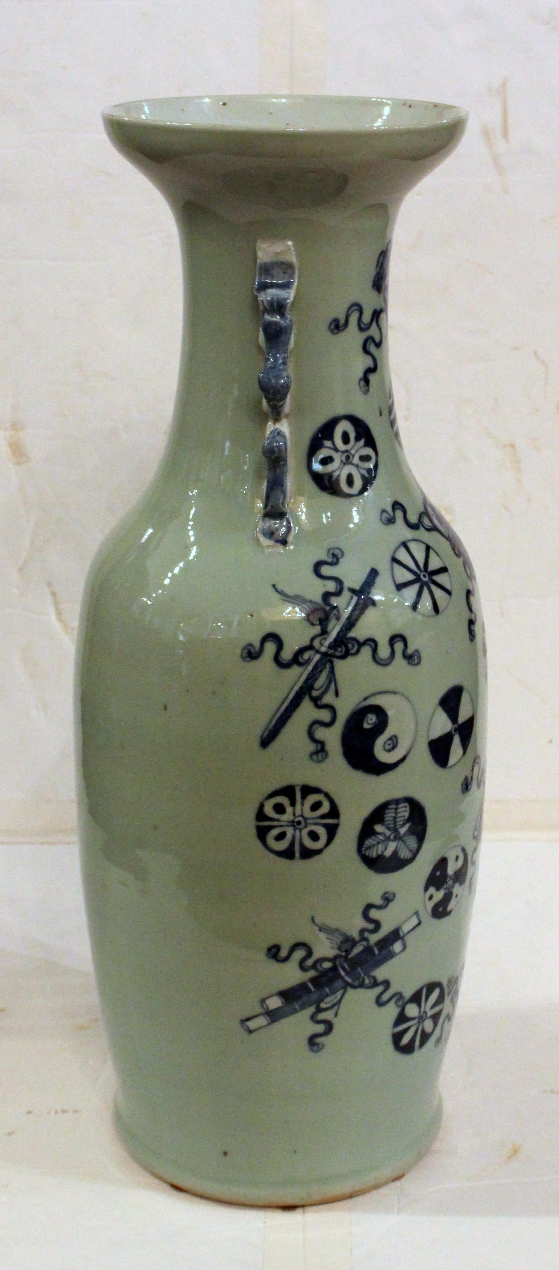 Late 19th century Chinese export porcelain vase, celadon ground. Late Qing dynasty. Blue & white on celadon ground with double foo lion handles. Decorated on the front with auspicious & Taoist symbols. Good condition. A few base rim scuffs. Right