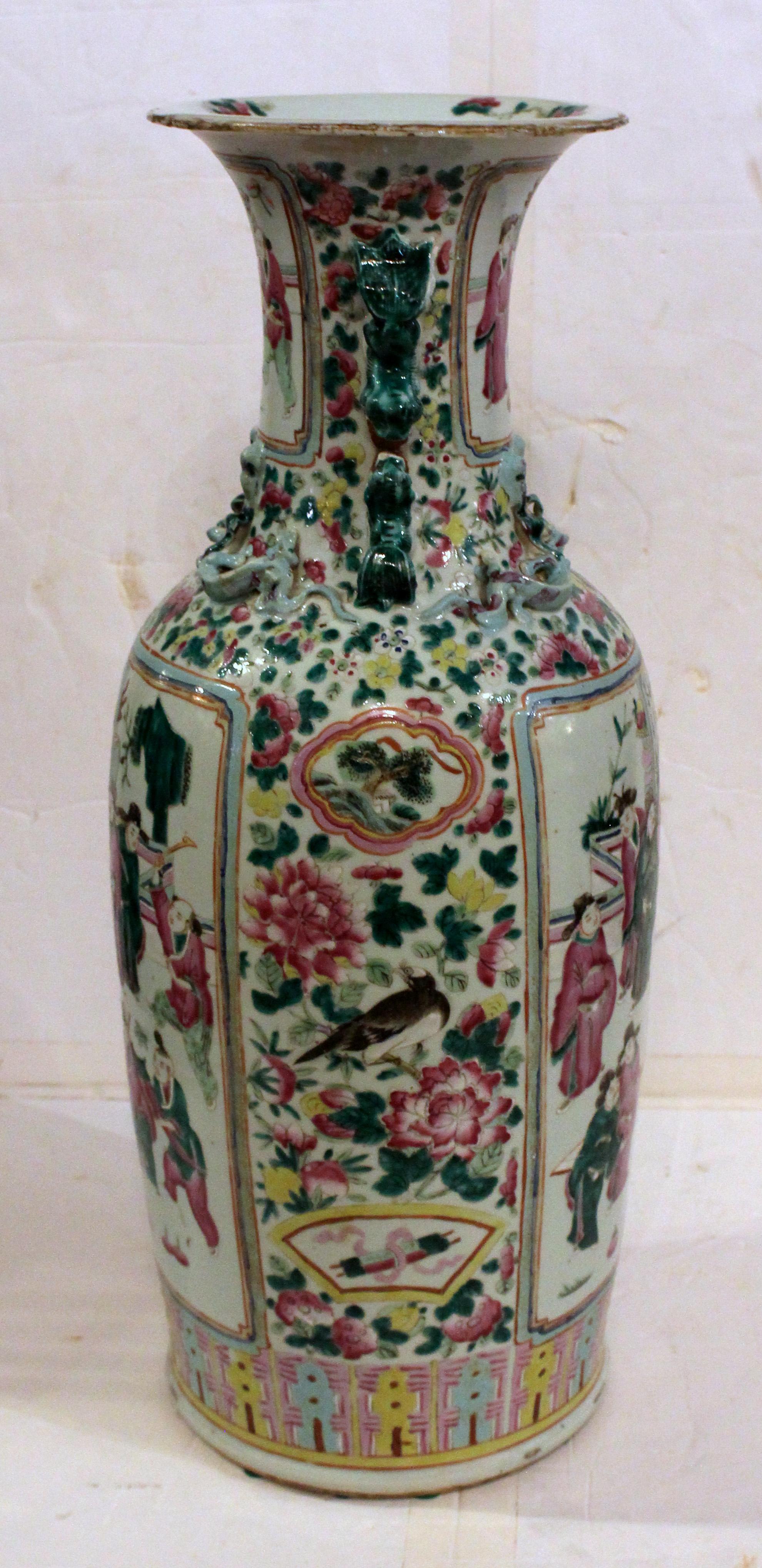 Late 19th century Chinese export porcelain tall vase. Large scale, late Qing dynasty, famille rose double dragon handled vase. Shoulder dragons & large scenes of scholars. The reserves are surrounded by peonies, flowers, fruits & birds. Gilding on