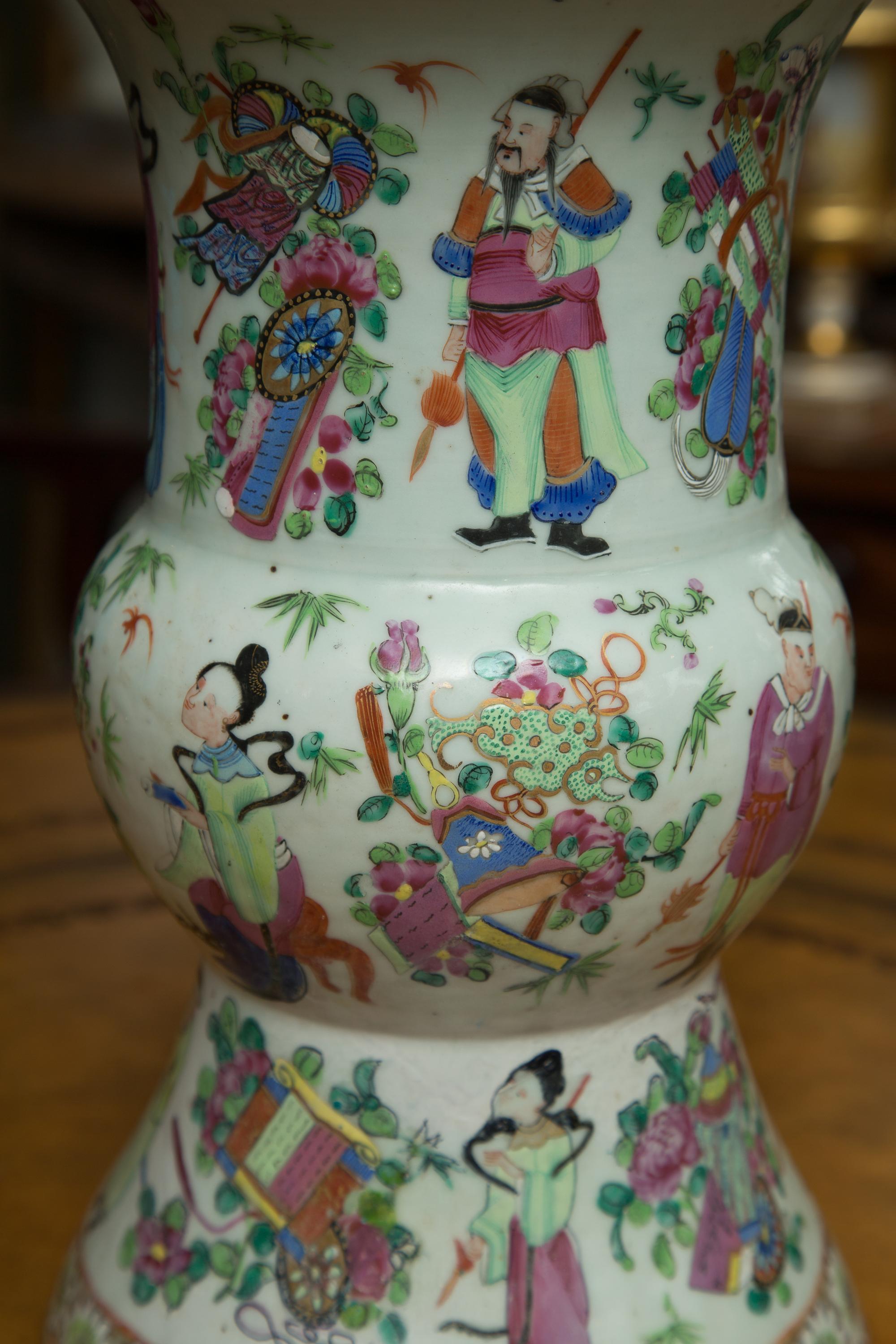 This is a lovely Chinese rose famille flared shaped urn painted overall with Classic Chinese motifs of figures and floral patterns, late 19th century.