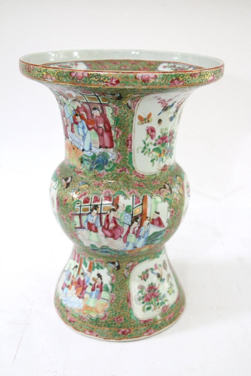 Late 19th century Chinese export rose medallion ku-form vase
containing colorful scenes of family life enhanced by significant depictions of birds, flowers, and butterflies. 

Dimensions: 15 ½” H x 10 ¾” W (at the top).

   