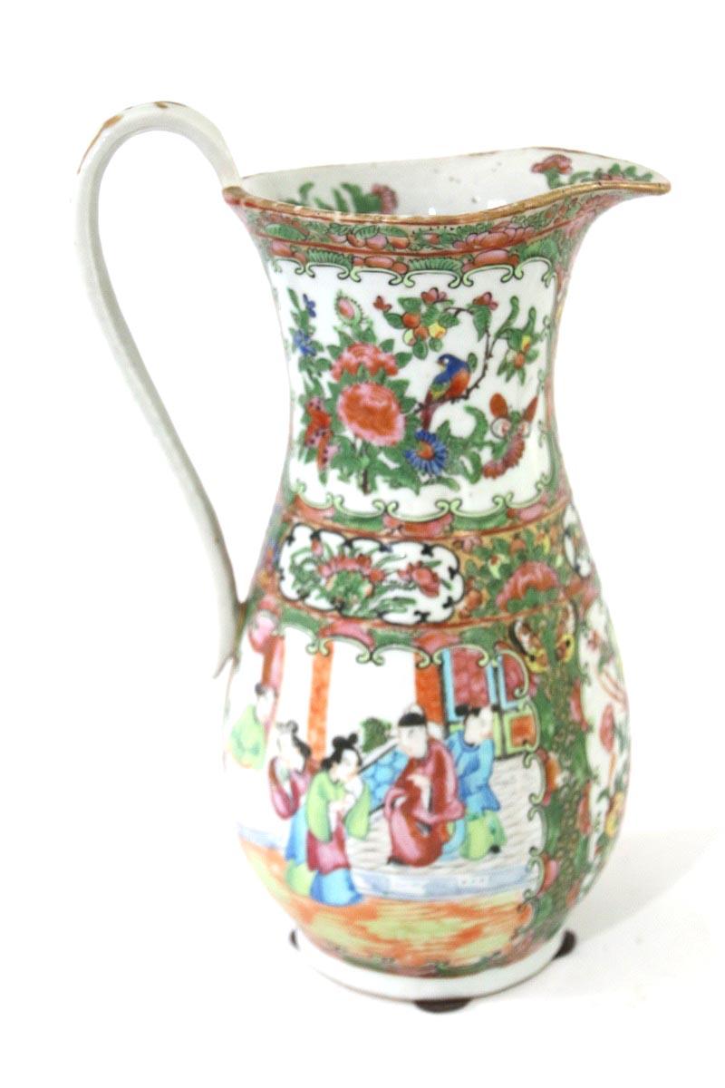 Late 19th century Chinese export rose medallion pitcher decorated with panels of figures, flowers, and exotic birds.

Measures: 11 ½” height (tip of handle) x approximately 7 ½: in diameter from handle to spout.