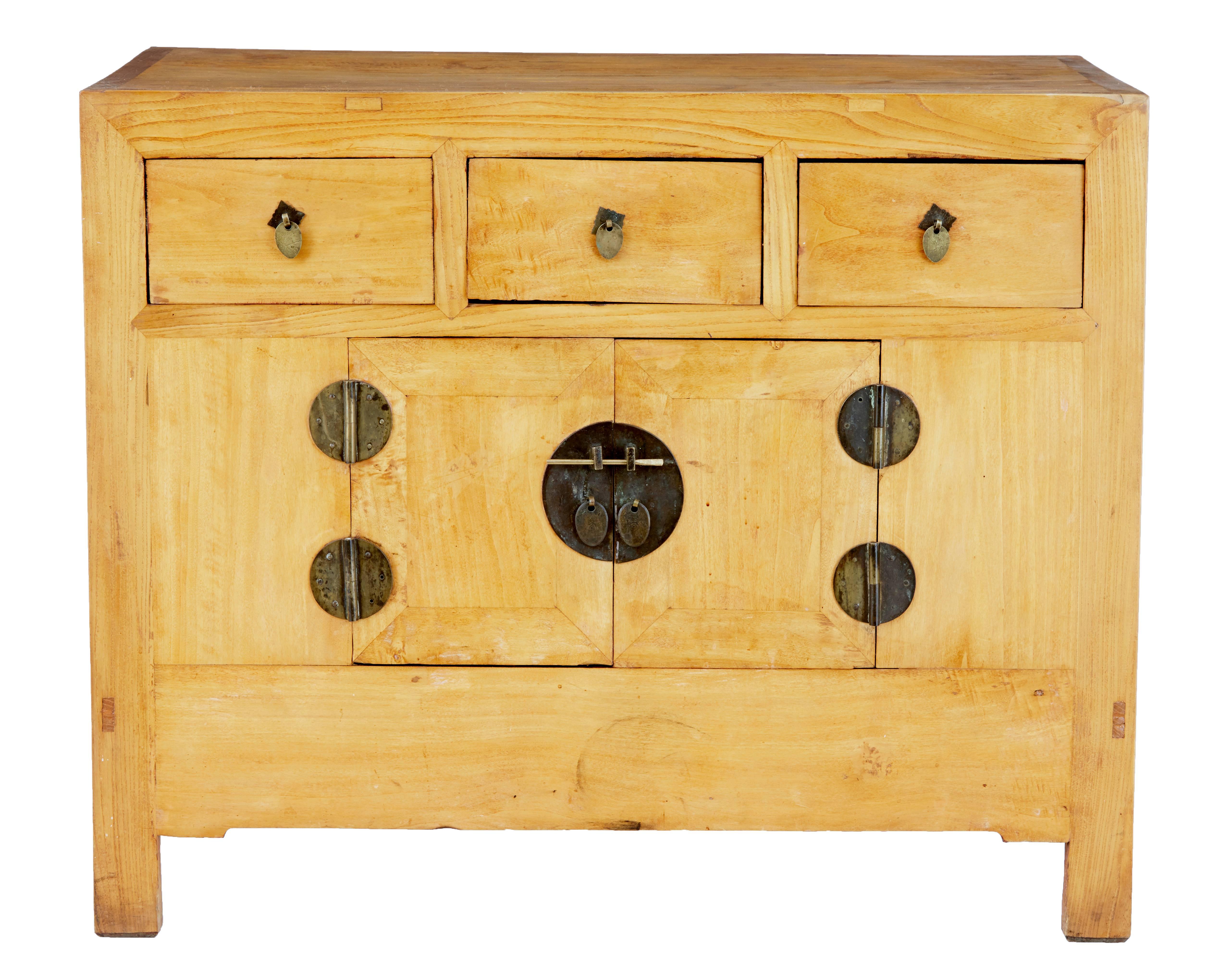 Functional piece of Chinese export furniture, circa 1890.

Made from oriental softwood, with three drawers below the top surface and a double door cupboard below. Original hardware. Displaying evidence from the interior to have been previously red