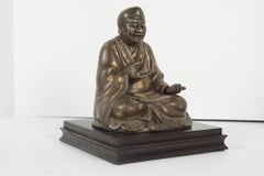 Late 19th Century Chinese Gold Fleck Cast Bronze Figure of Buddha