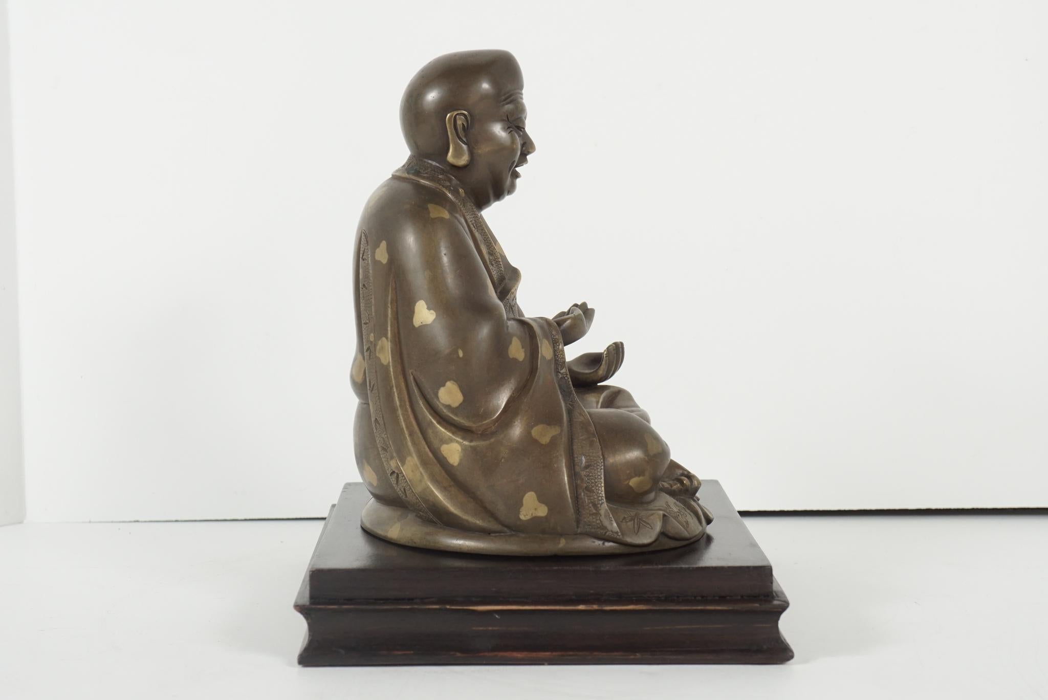 Patinated Late 19th Century Chinese Gold Fleck Cast Bronze Figure of Buddha For Sale