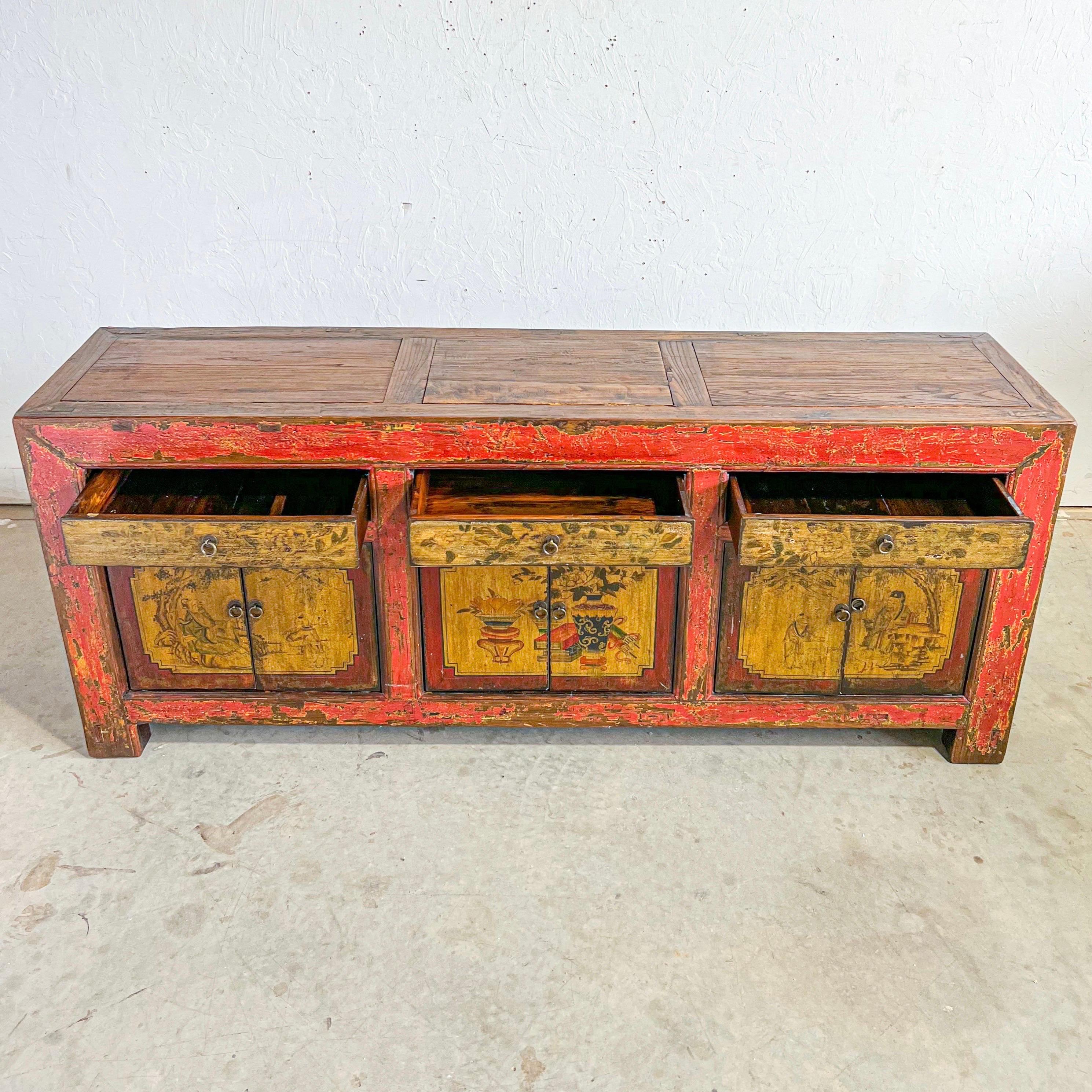 Late 19th Century Chinese Hand Painted Sideboard 

from the province of gansu, this sideboard is really a functional piece of art. with a nicely developed patina, each cupboard door is hand painted with a different depiction along with the