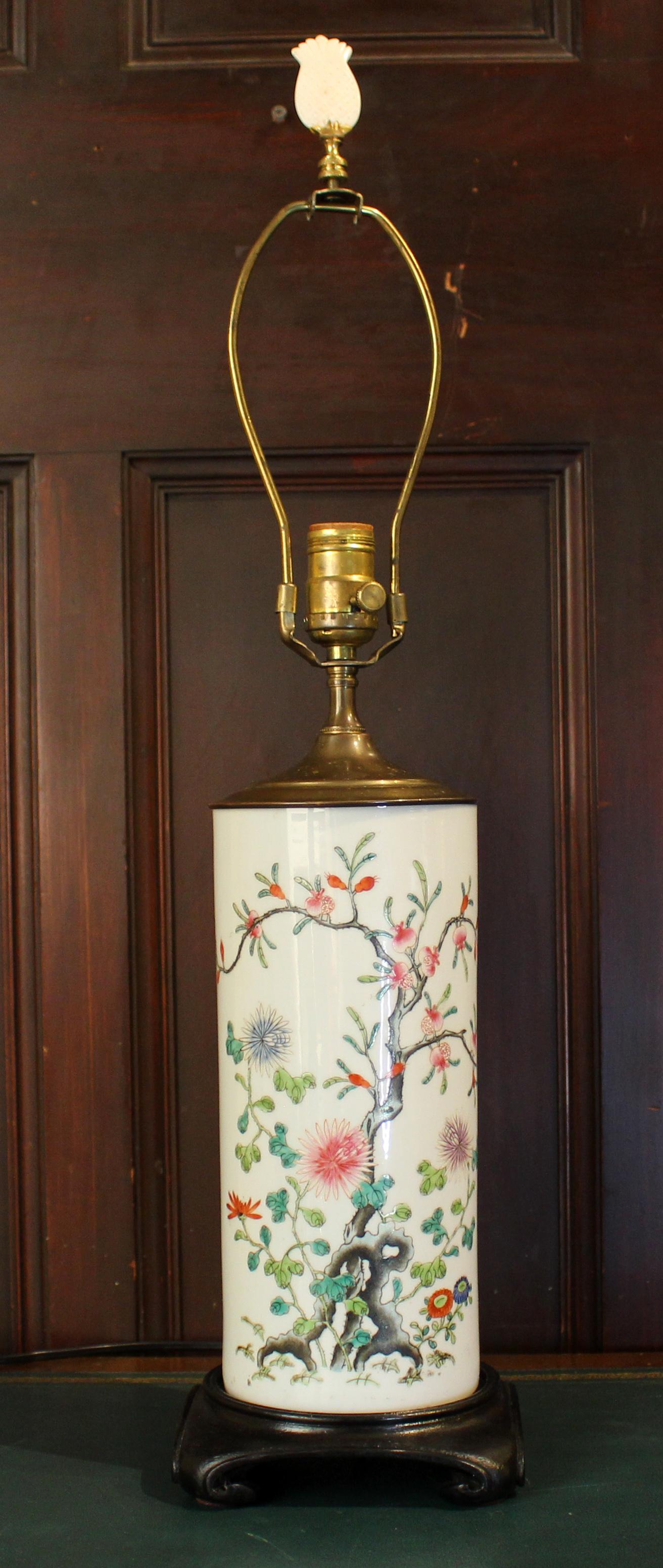 Late 19th century Chinese porcelain cylinder wig stand now mounted as a lamp. Late Qing Dynasty. Decorated with gnarled tree & various flowers. Provenance: Estate of Katharine Reid former director Cleveland Museum of Art. 6 1/4