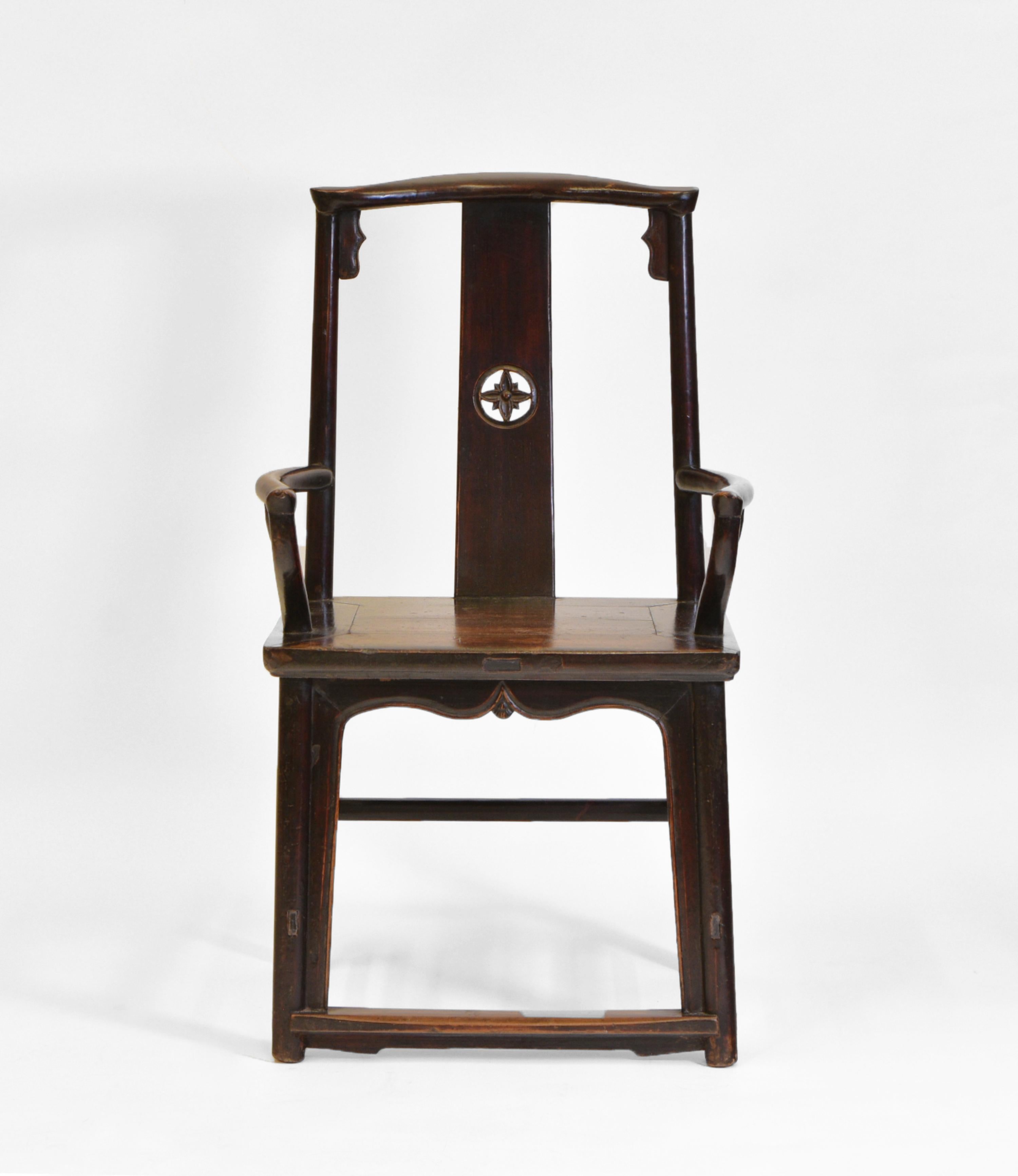 An antique Chinese open hardwood armchair. Circa 1880.

The chair shows good patina and age related wear to the finish. An upright design with an arched splat following the curve of the spine. Decorative apron under the seat leading down to the