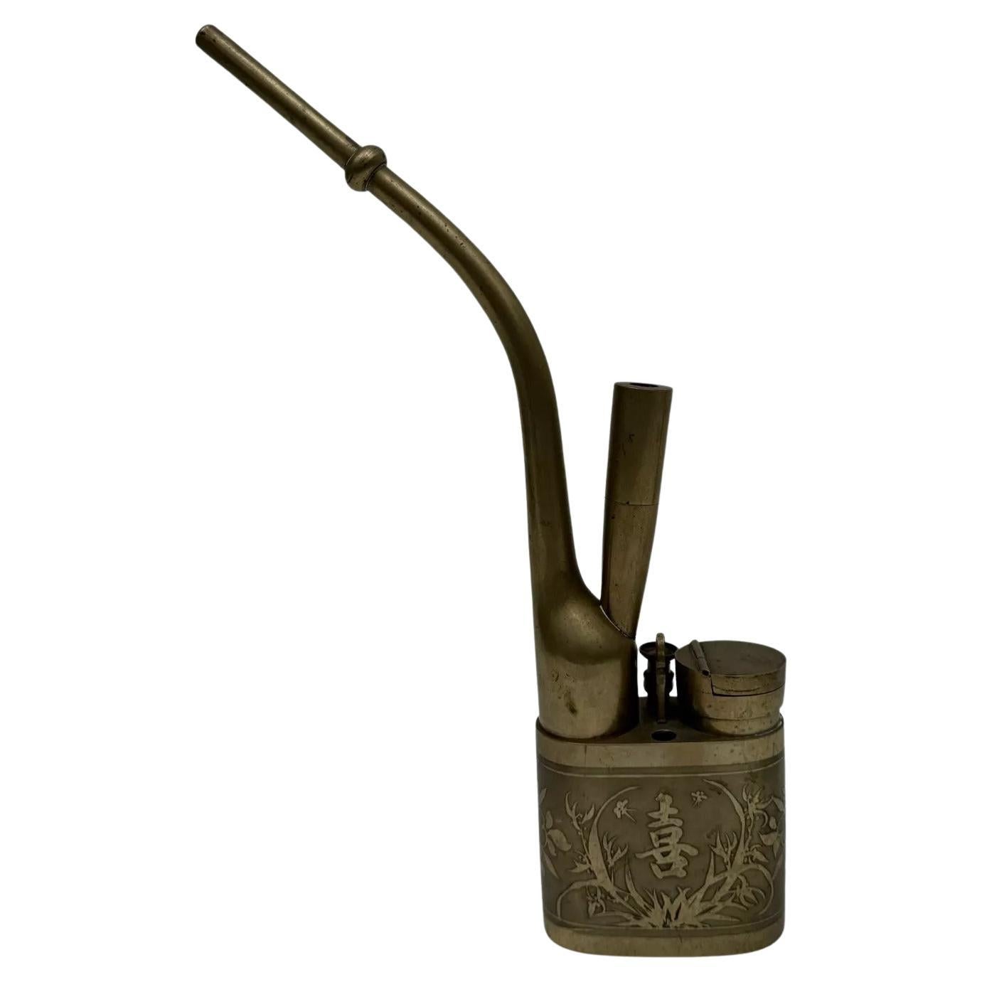 Late 19th century Chinese pipe enhanced with plant decorations