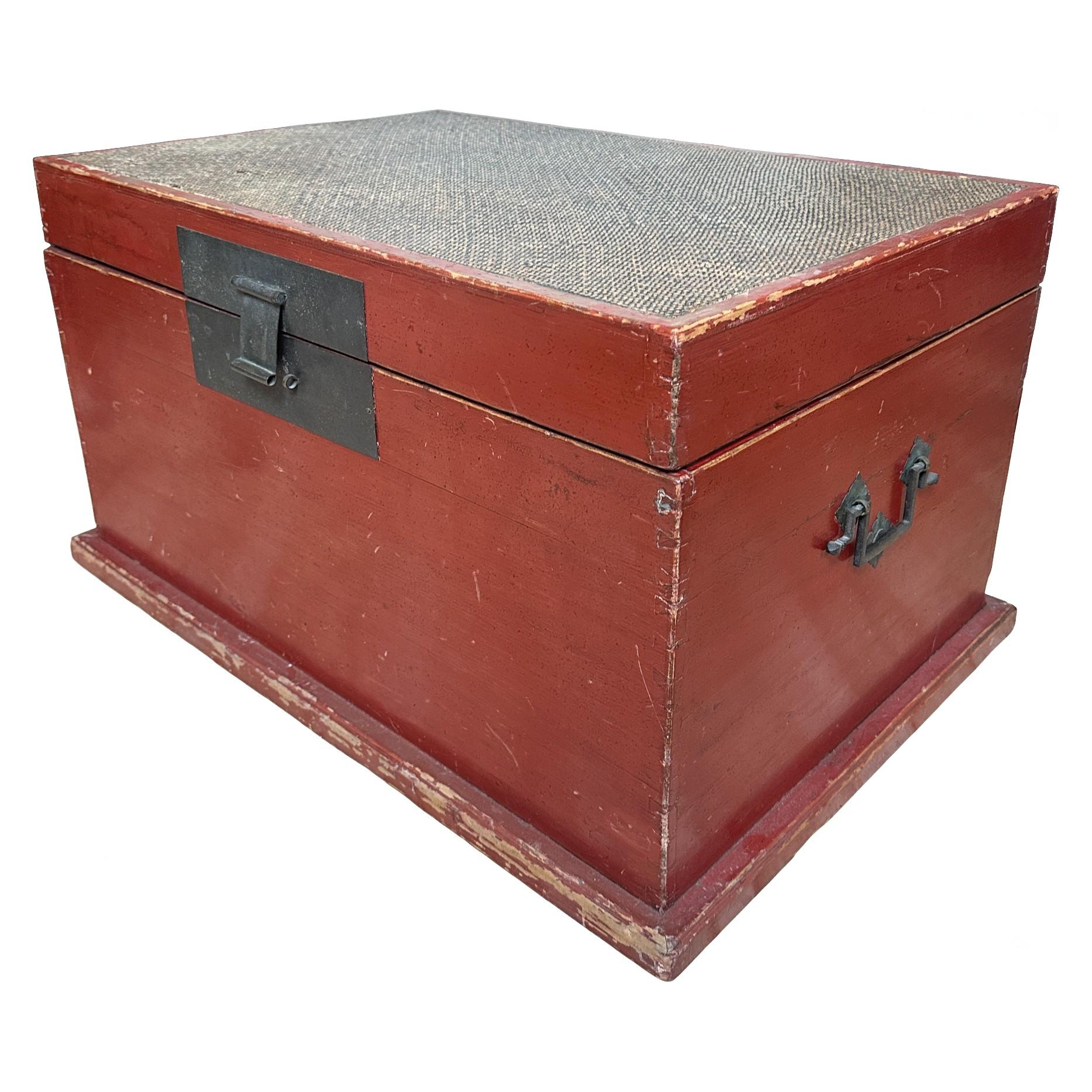 Late 19th century Chinese red lacquer blanket chest with rattan top. These chests were often used for storage in homes, particularly for bedding and textiles, combining functionality with aesthetic appeal. The sturdy wooden construction and