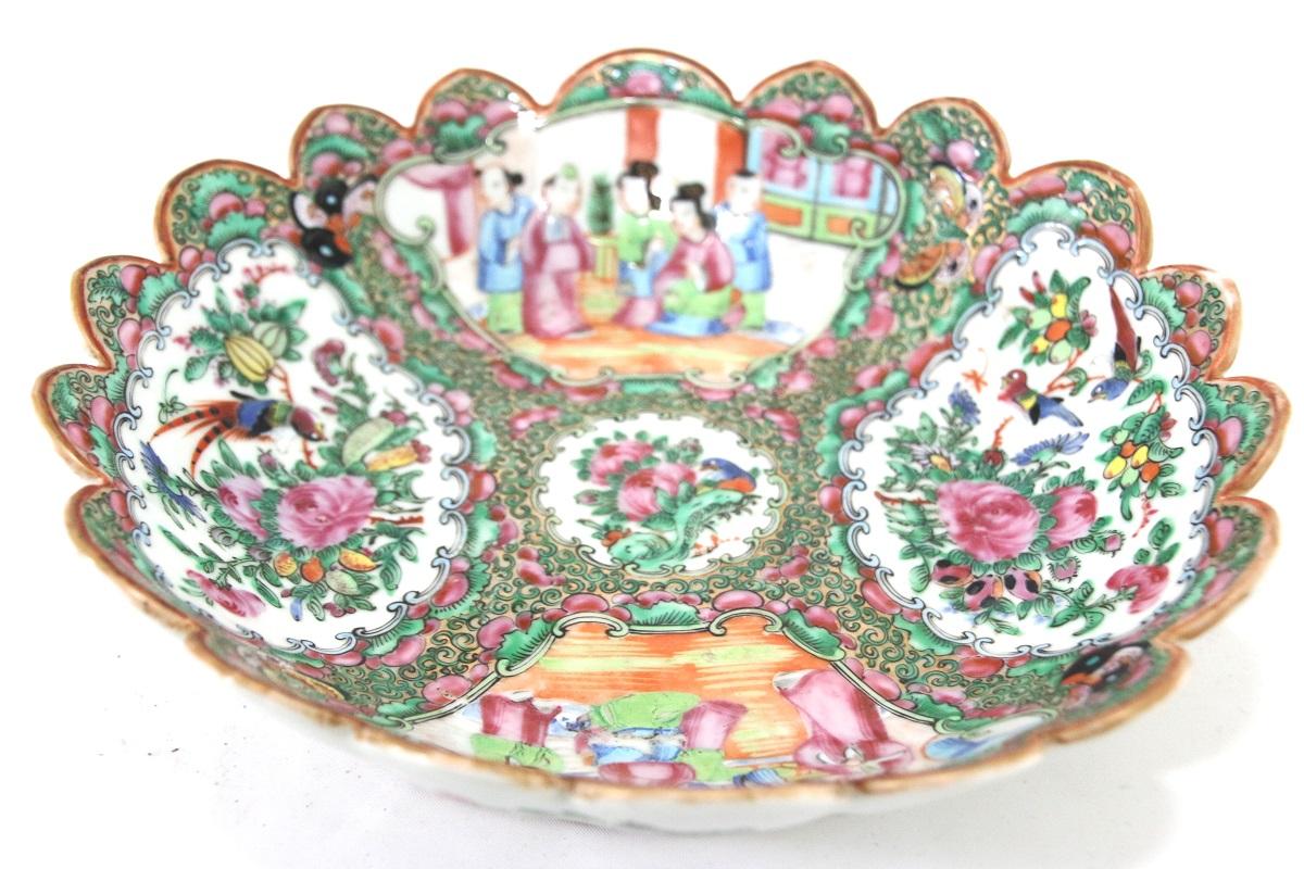 Chinese rose Medallion scalloped rim bowl containing colorful scenes of family life enhanced by significant depictions of birds, flowers, and butterflies.

Dimensions: 10” diameter x 2 ½” height.
 