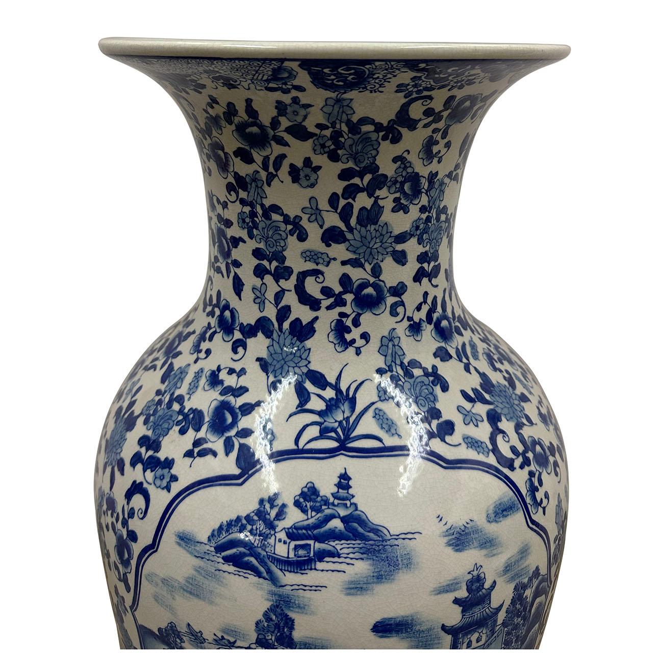 This 19th century blue and white porcelain vase is a classical Chinese vase. The vase features hand painted intricate traditional chinese floral and landscapes in shades of blue on a white background. Chinese ceramics have a long and rich history