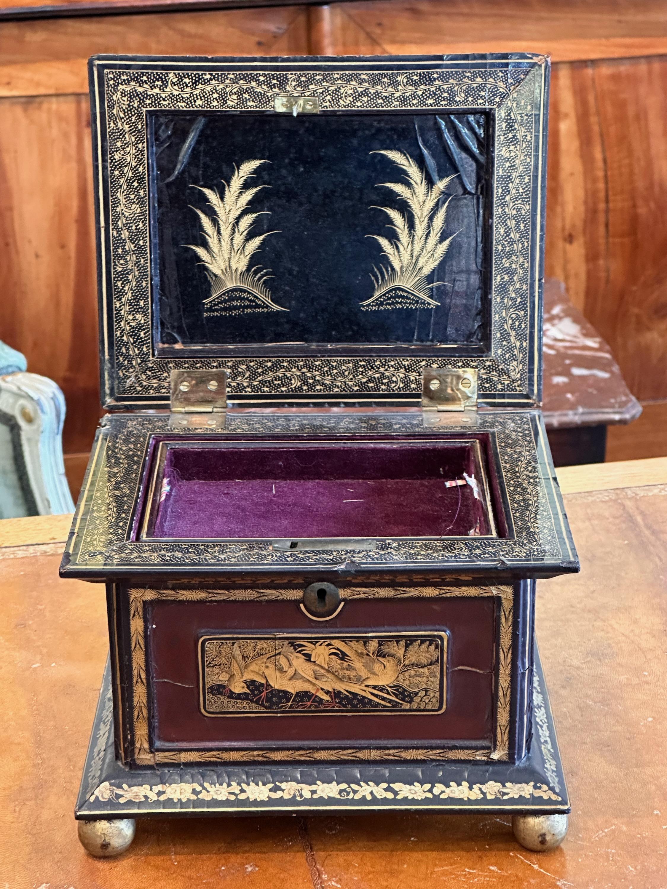 A lacquered box with Asian decorations. Great for the collector