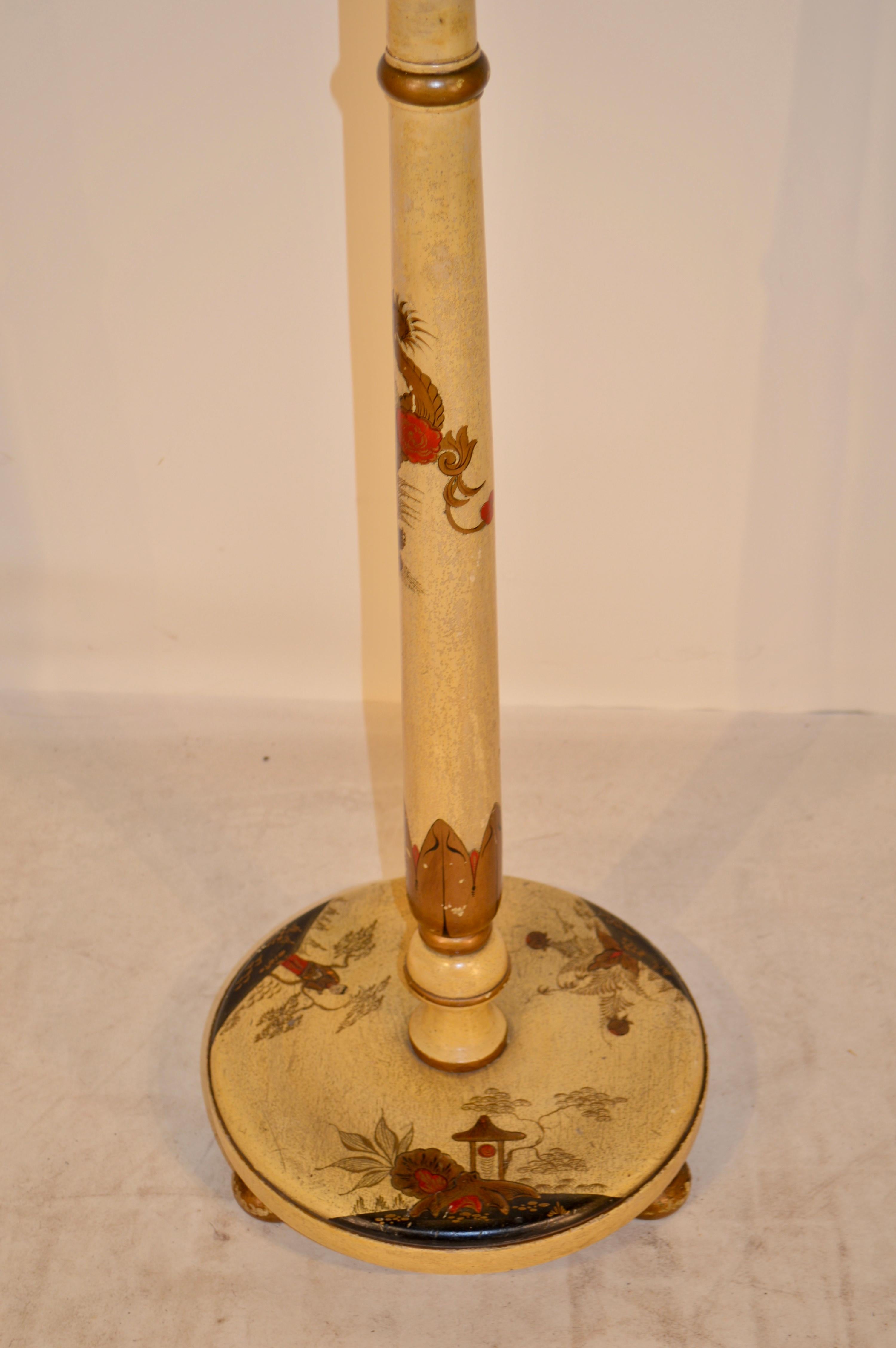 19th century English Victorian floor lamp with chinoiserie scenes of a village over a pale yellow base color. Wired for US use and in good working condition.
 