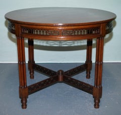 LATE 19TH CENTURY CHIPPENDALE STYLE ROUND OCCASiONAL TABLE AND CARVED STRETCHERS
