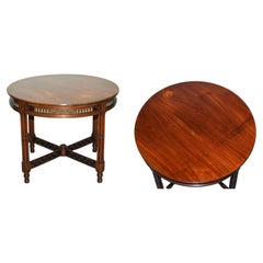 LATE 19TH CENTURY CHIPPENDALE STYLE ROUND OCCASiONAL TABLE AND CARVED STRETCHERS