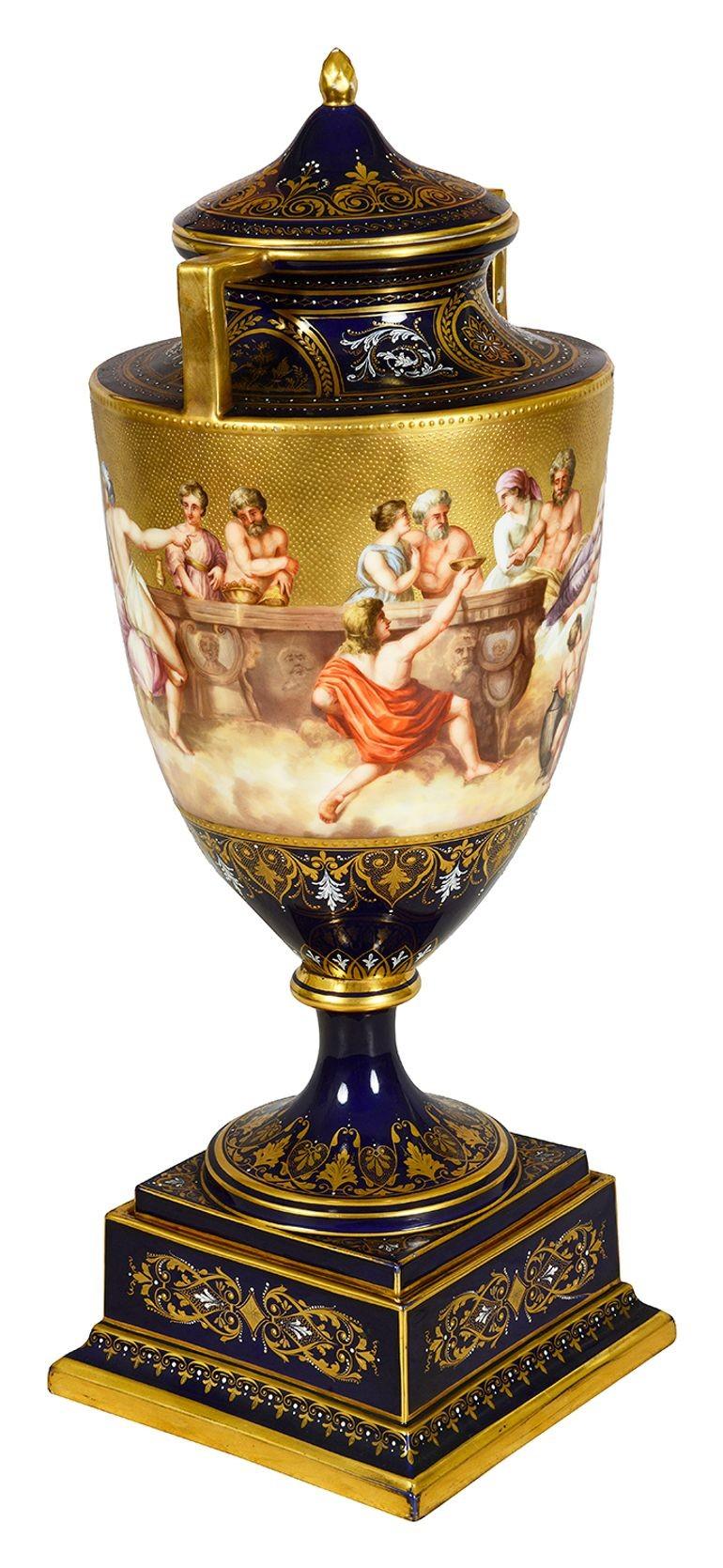 This exquisite late 19th-century Vienna porcelain lidded urn beautifully depicts “The Flourish of the Plagues of Thetis.” The urn features intricate hand-painted scenes of mythological figures, showcasing Thetis surrounded by other deities and